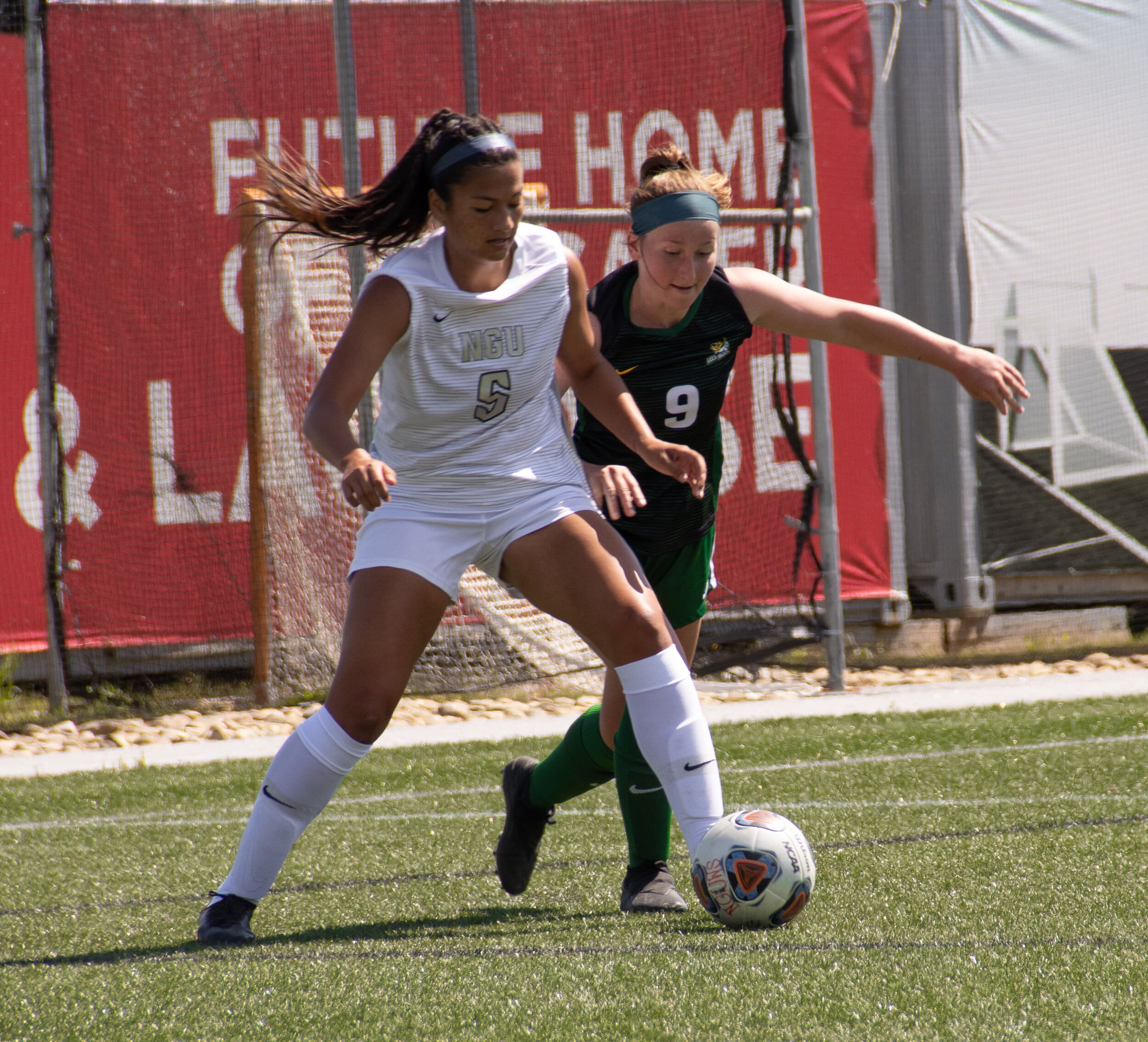 Junior centreback Joelle Chick shields the ball away from a bobcat defender.