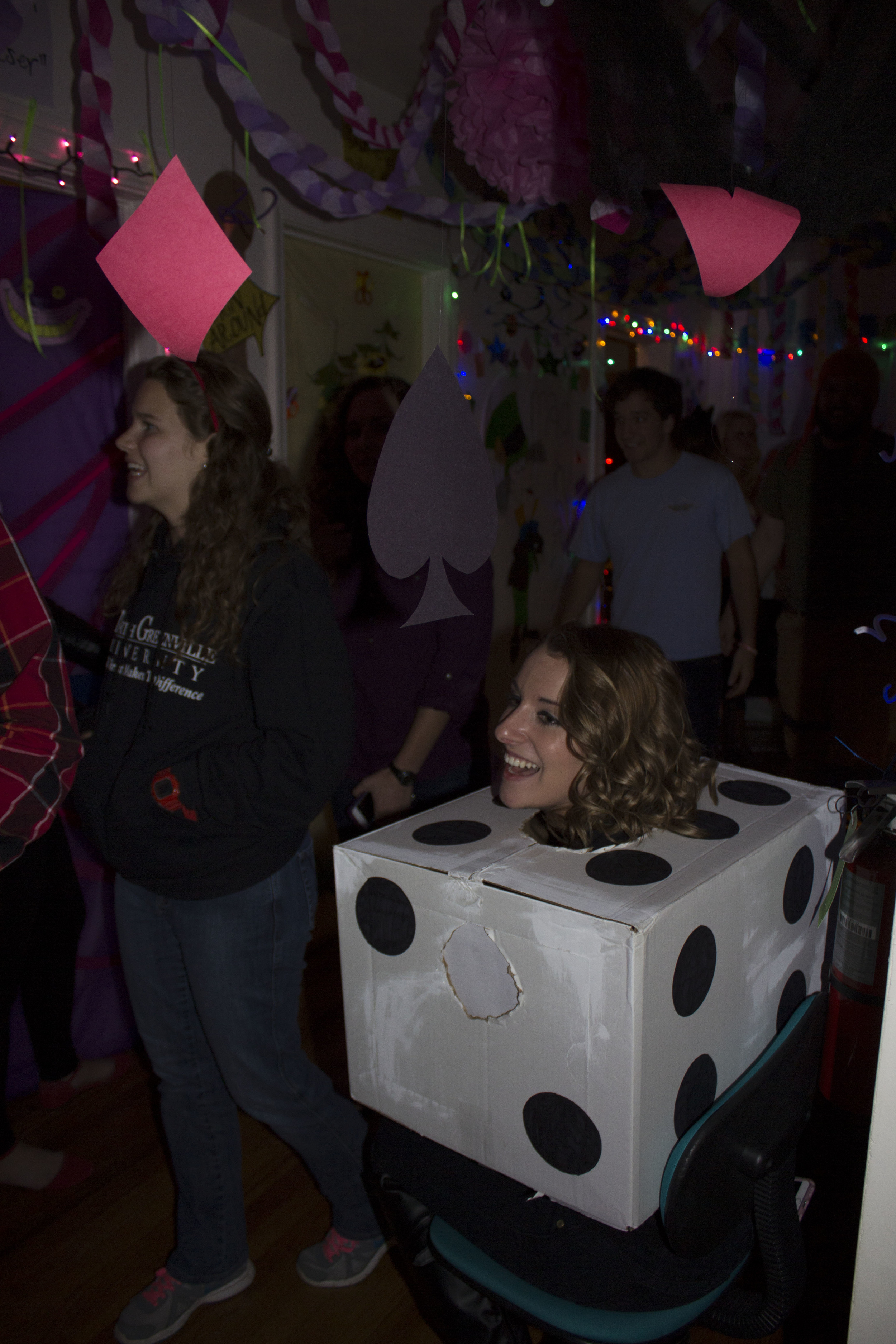  Sophomore Marianne Woodard laughs as she enjoys the different scenes and characters the girls in Chinquapin 8 dressed up as.&nbsp; 