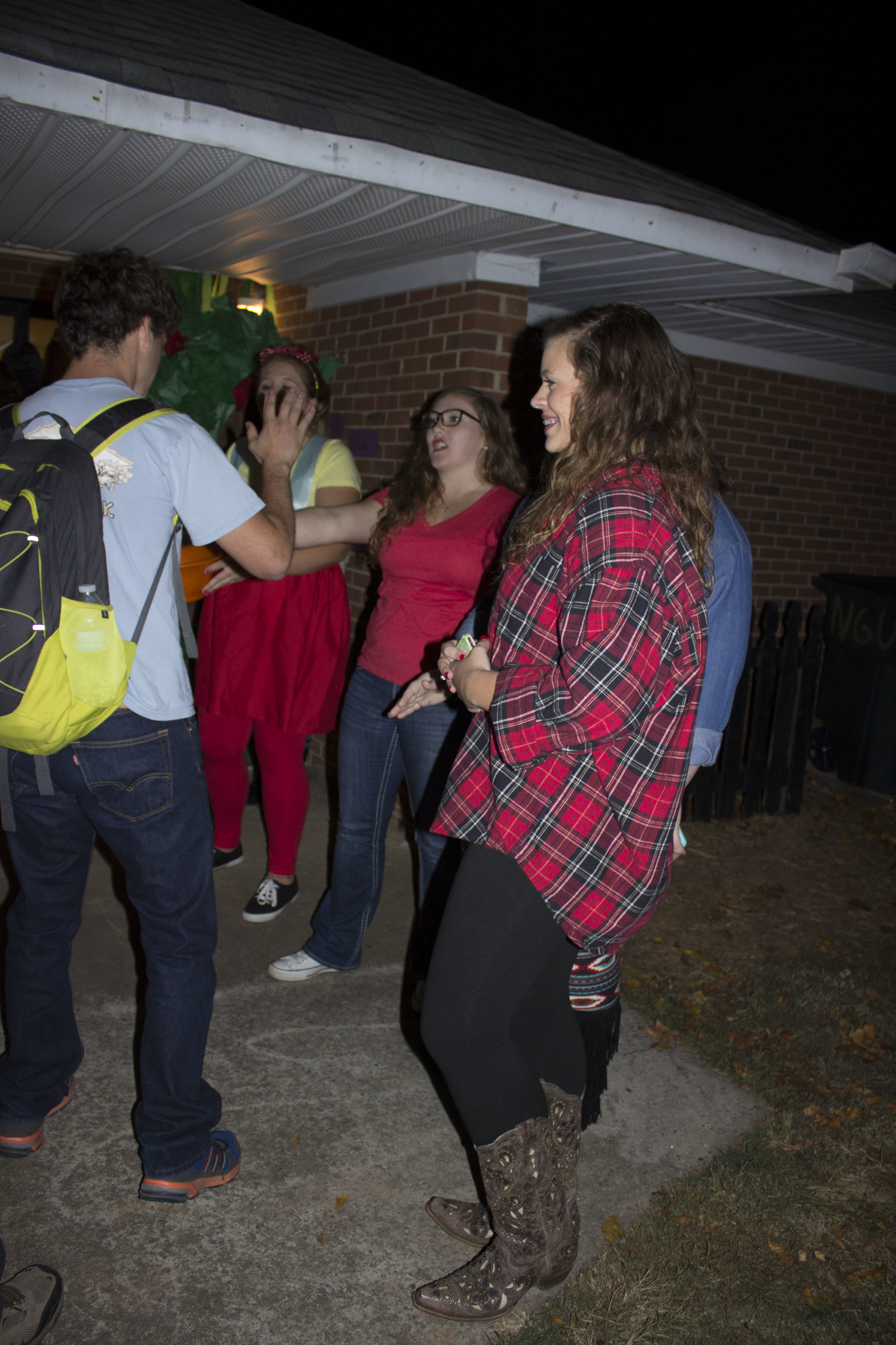  Phillip Salle high fives all the girls outside of one of the unit houses.&nbsp; 