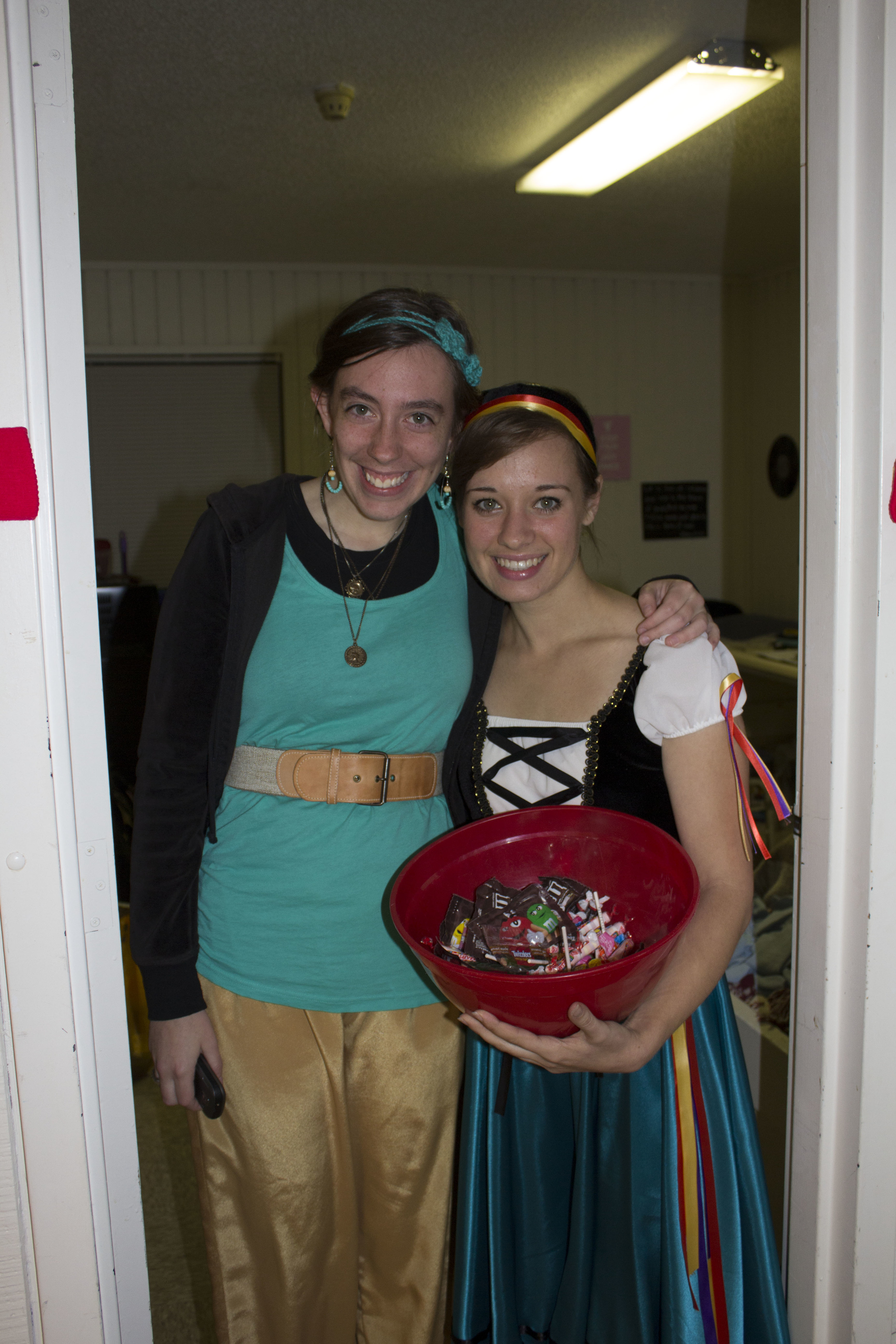  Juniors MaryEllen Lovin and Gabbi Miller show off their costumes while handing out candy to the kids that stop by.&nbsp; 