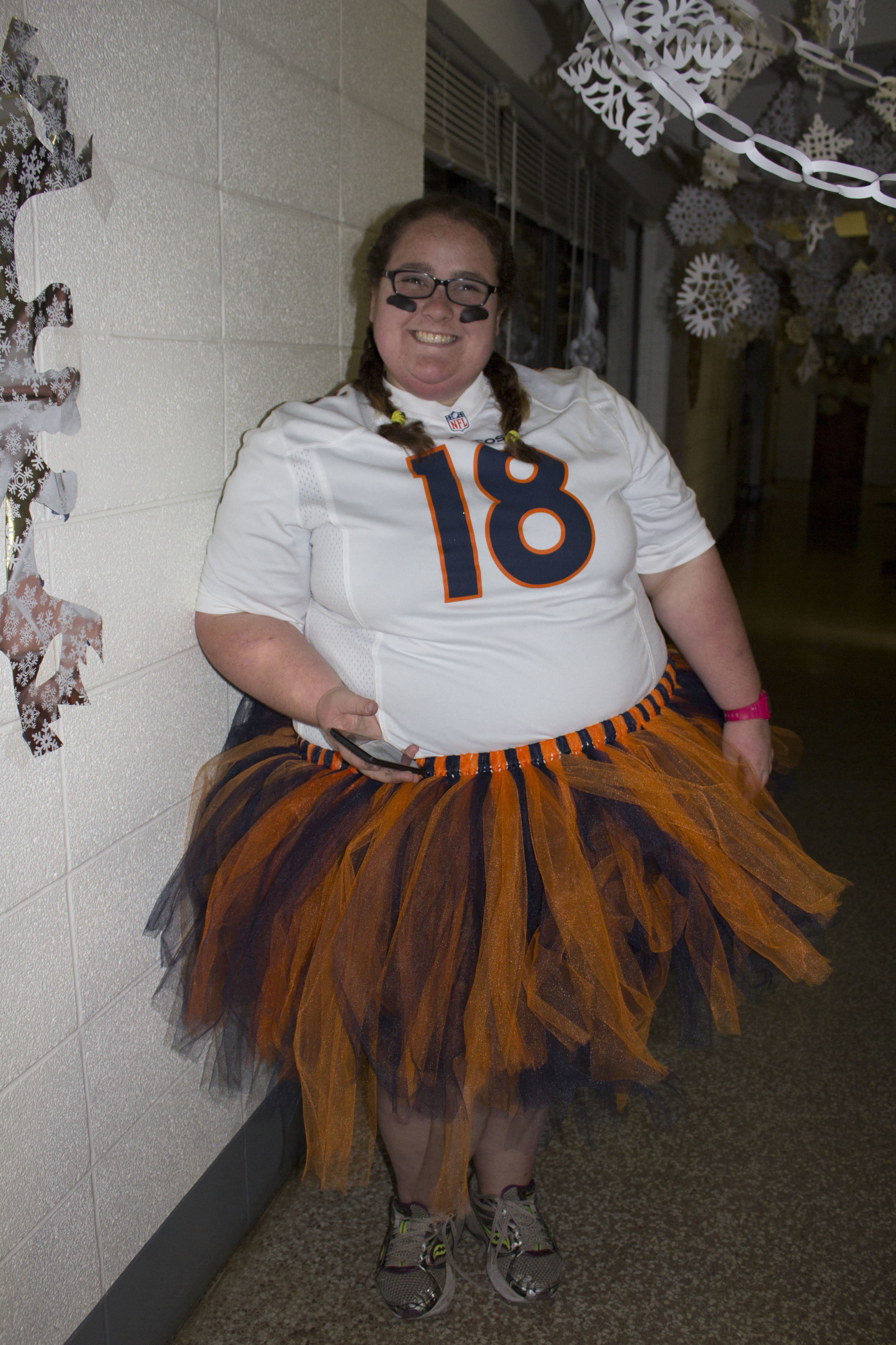  Junior Julia Bolton, RA of Simpson, shows off not only her costume but all the effort and work she and the other girls put into making their dorm look great for all the kids coming through during Halloween.&nbsp; 