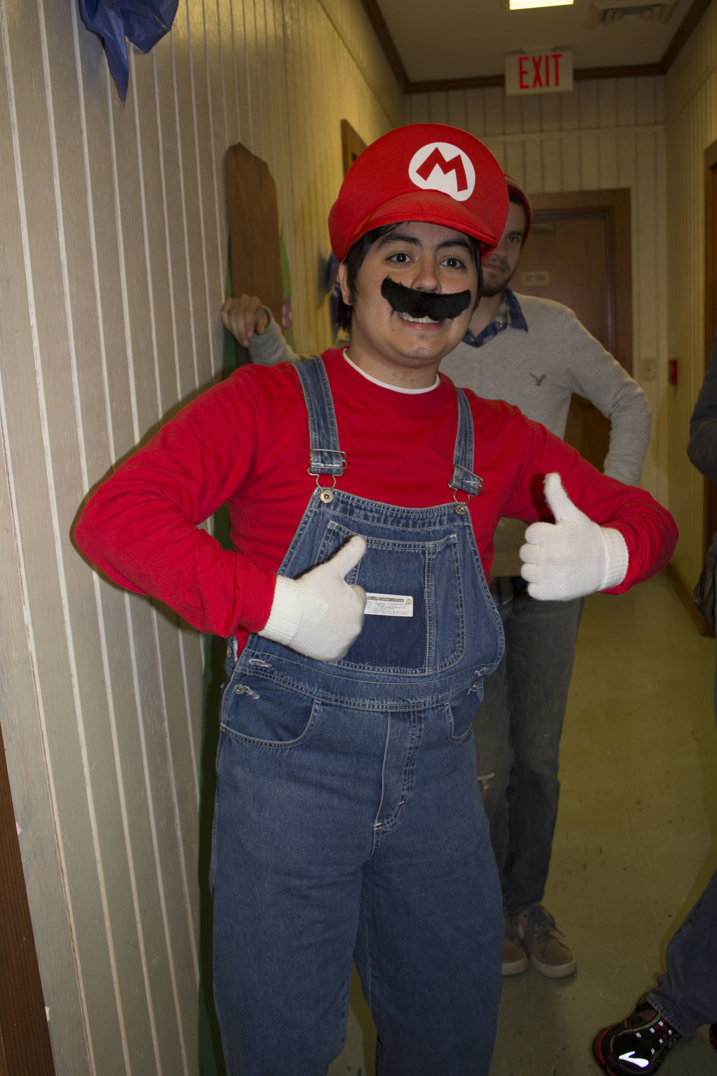  Senior Lucas Colmenares enjoys being Mario for an evening while going through the dorms.&nbsp; 