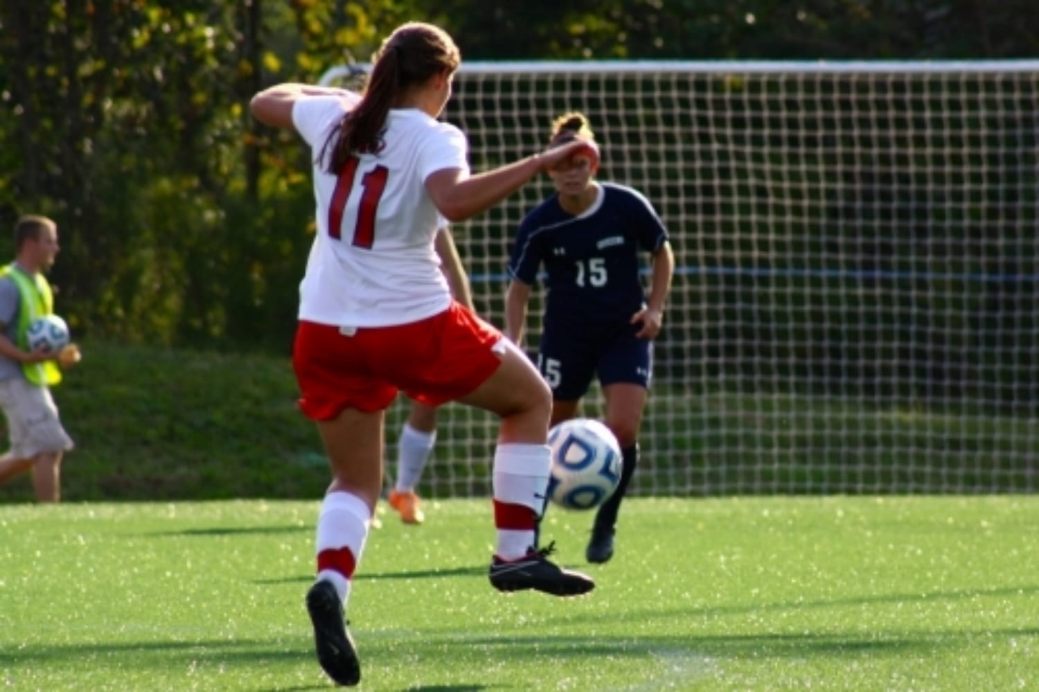  #11, Lauren Prevett, sends the ball flying. 