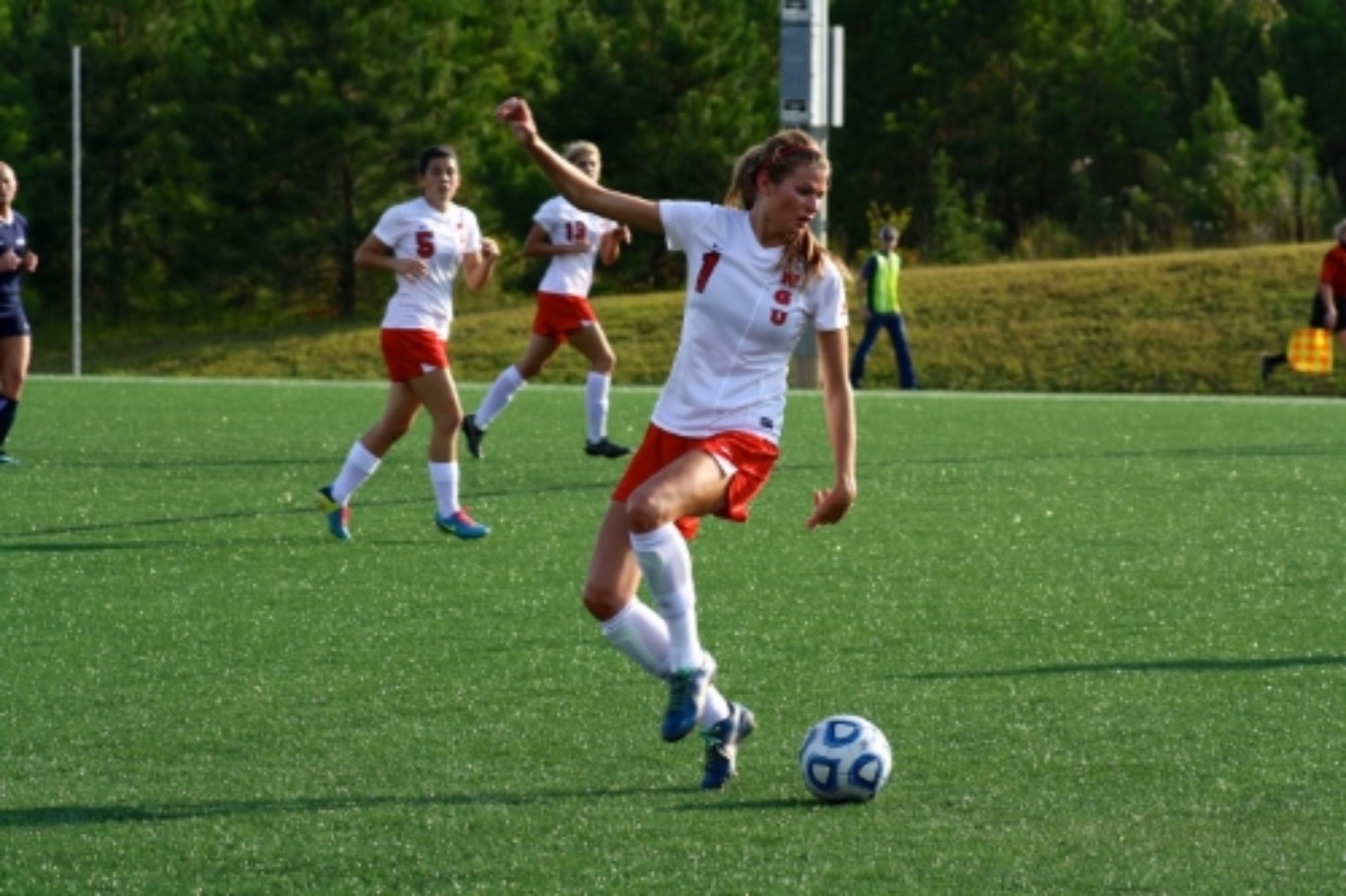  #1, Lindsay Tuten, kicks the ball. 