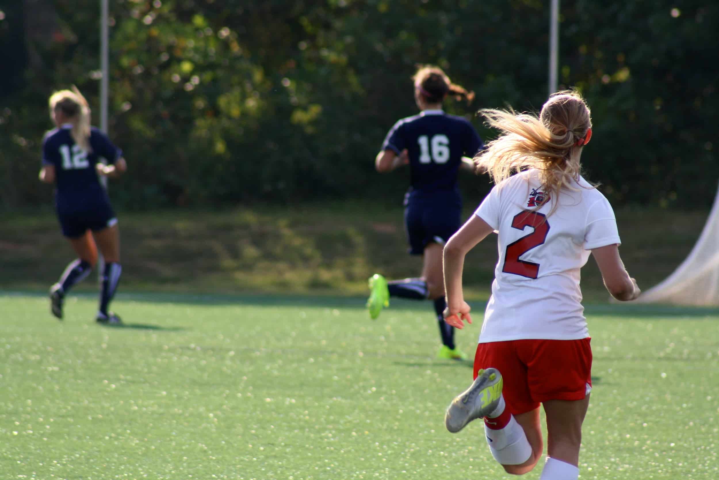  #2, Olivia Schmike, running towards her opponents. 