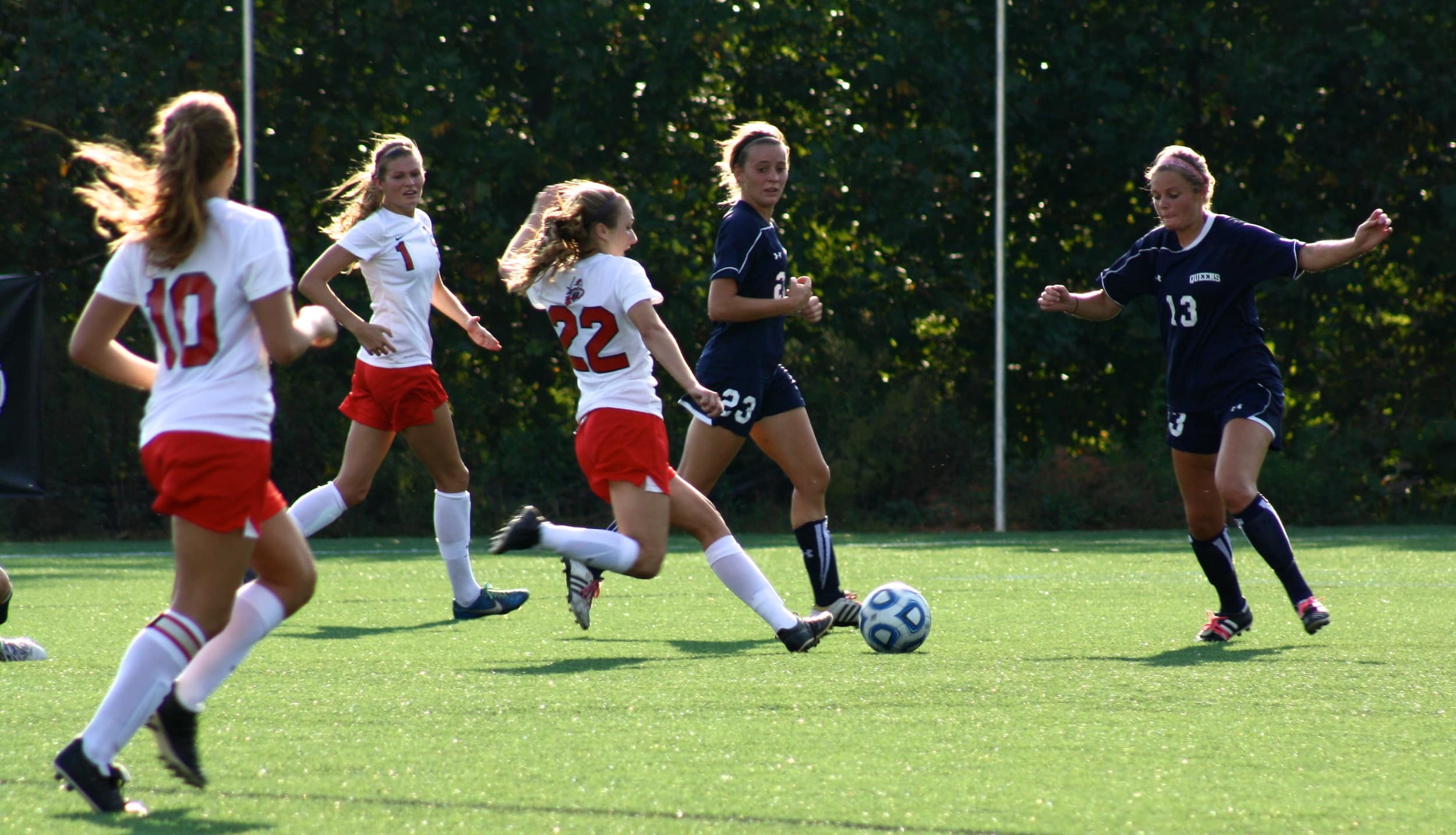  #22, Kathryn Allen, makes a successful attempt to kick the ball. 