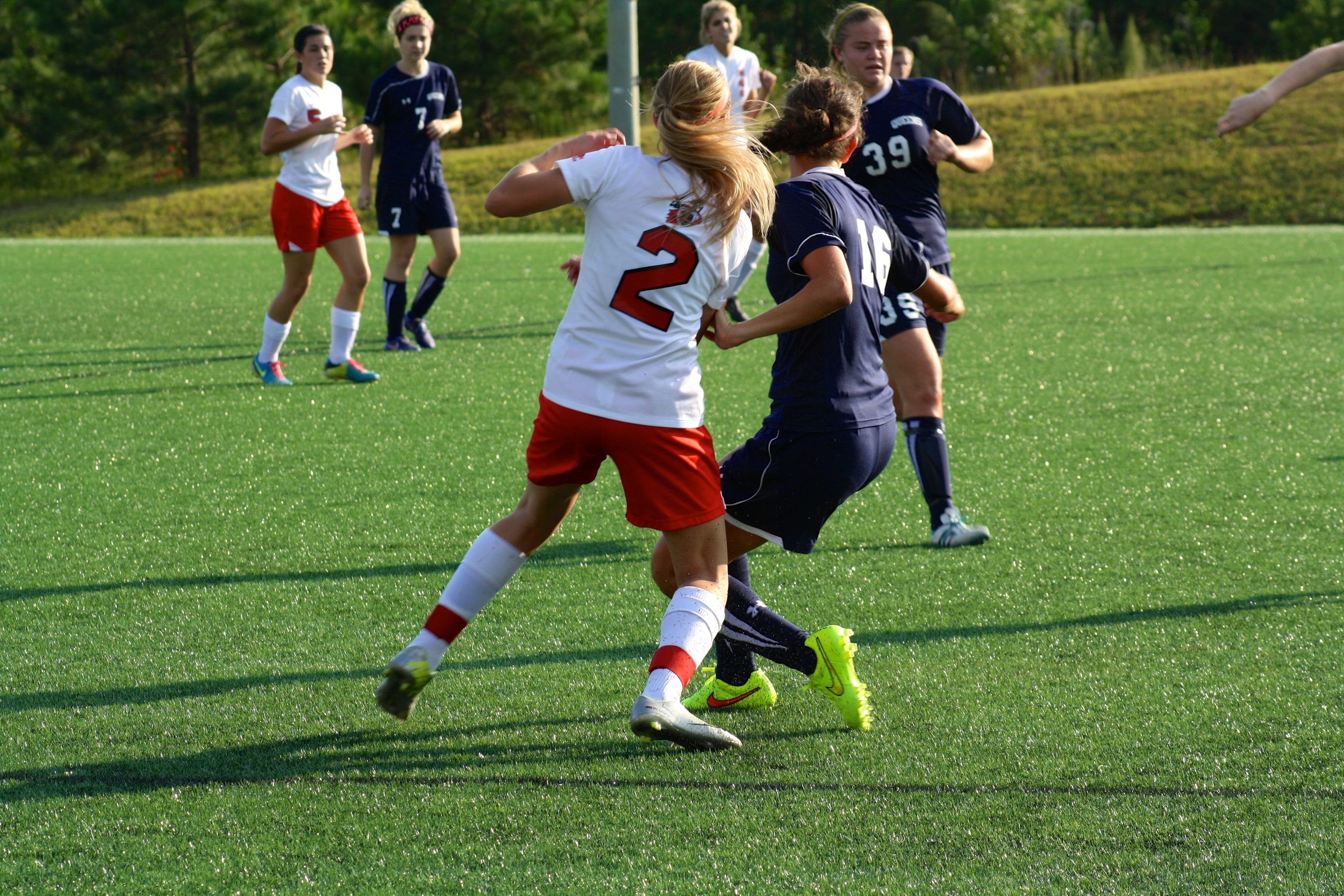  #2, Olivia Schmike, clashes with an opponent. 