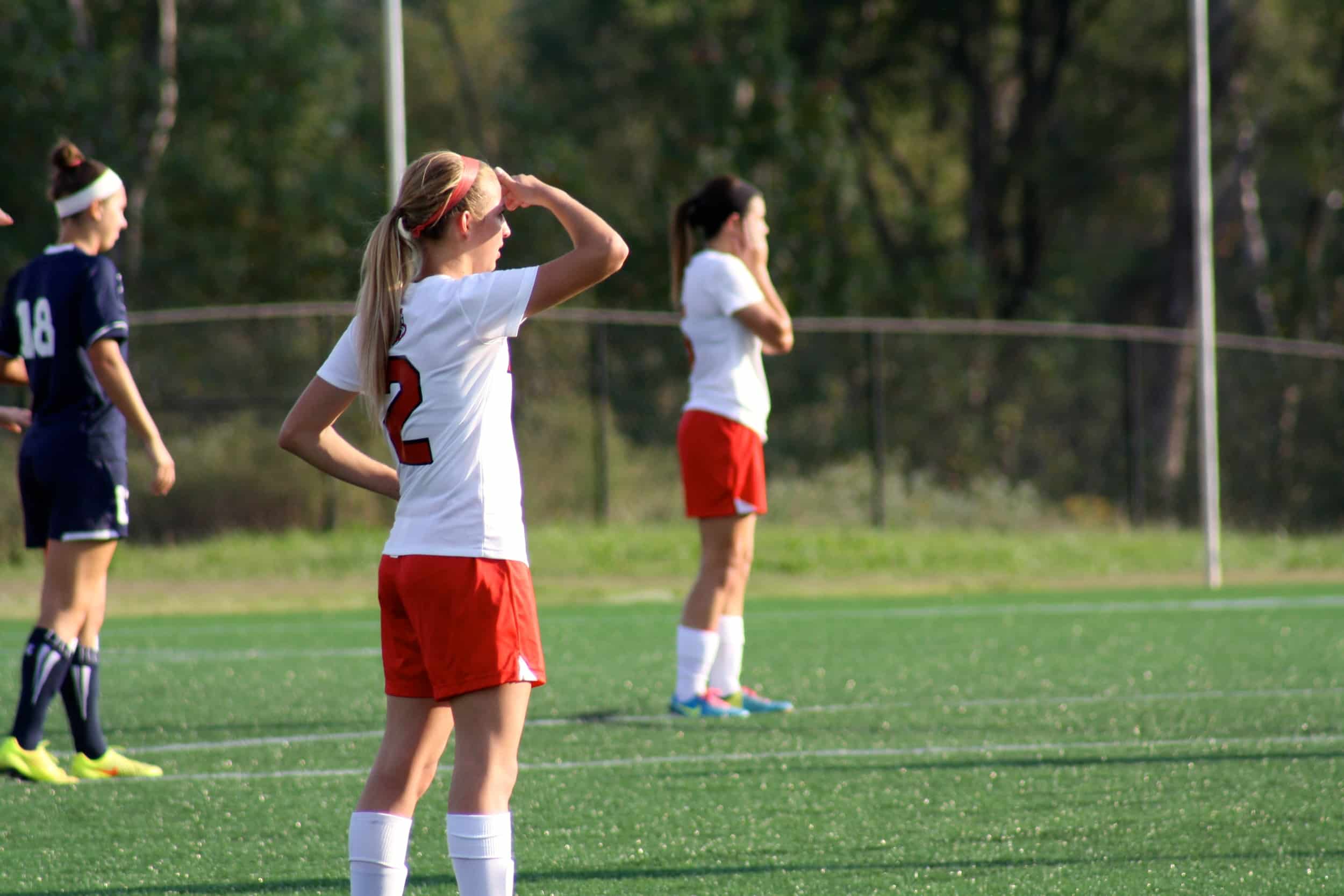  #2, Olivia Schmike, patiently waits for the ball to be put back into play. 