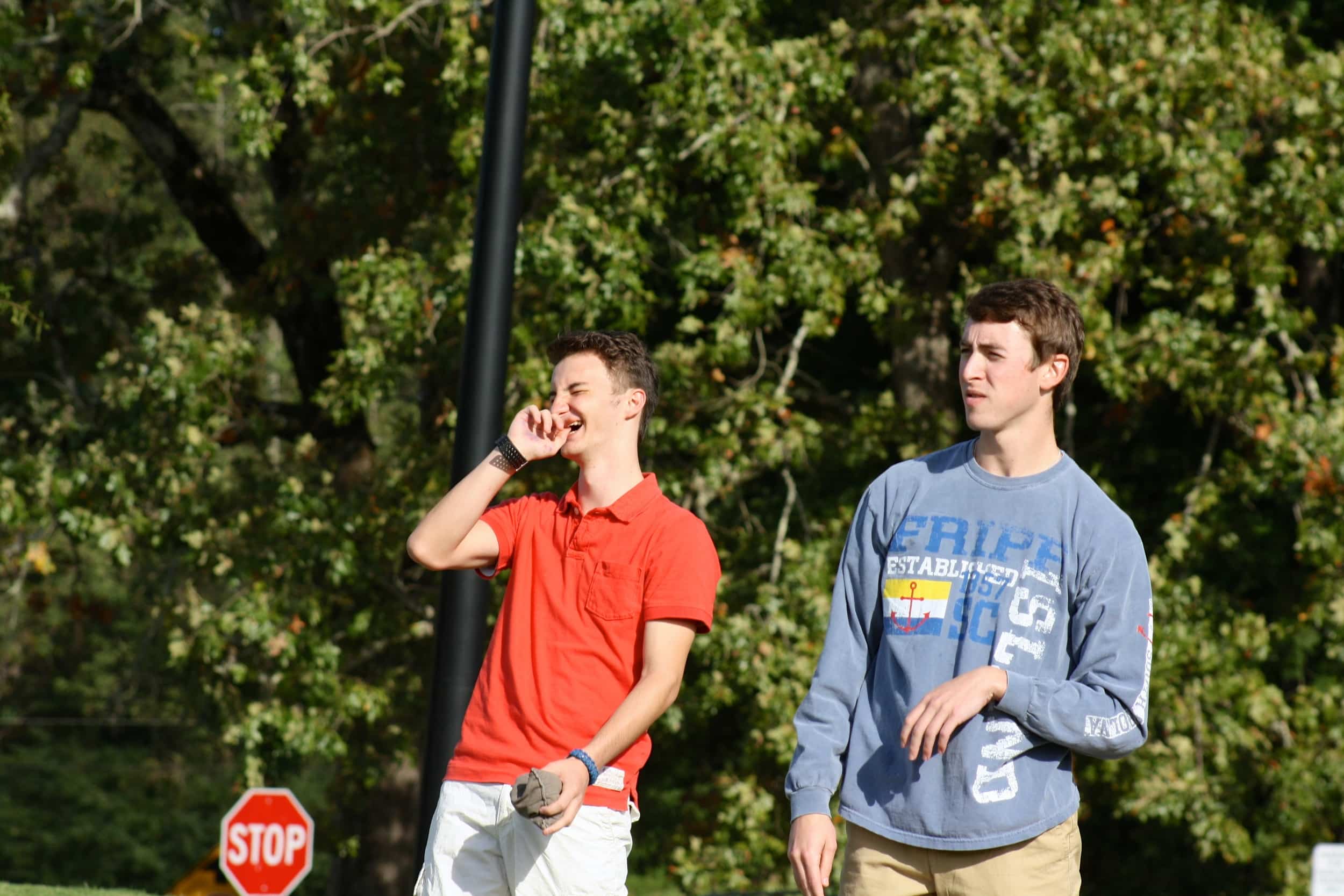  A student laughs with his competitors. 