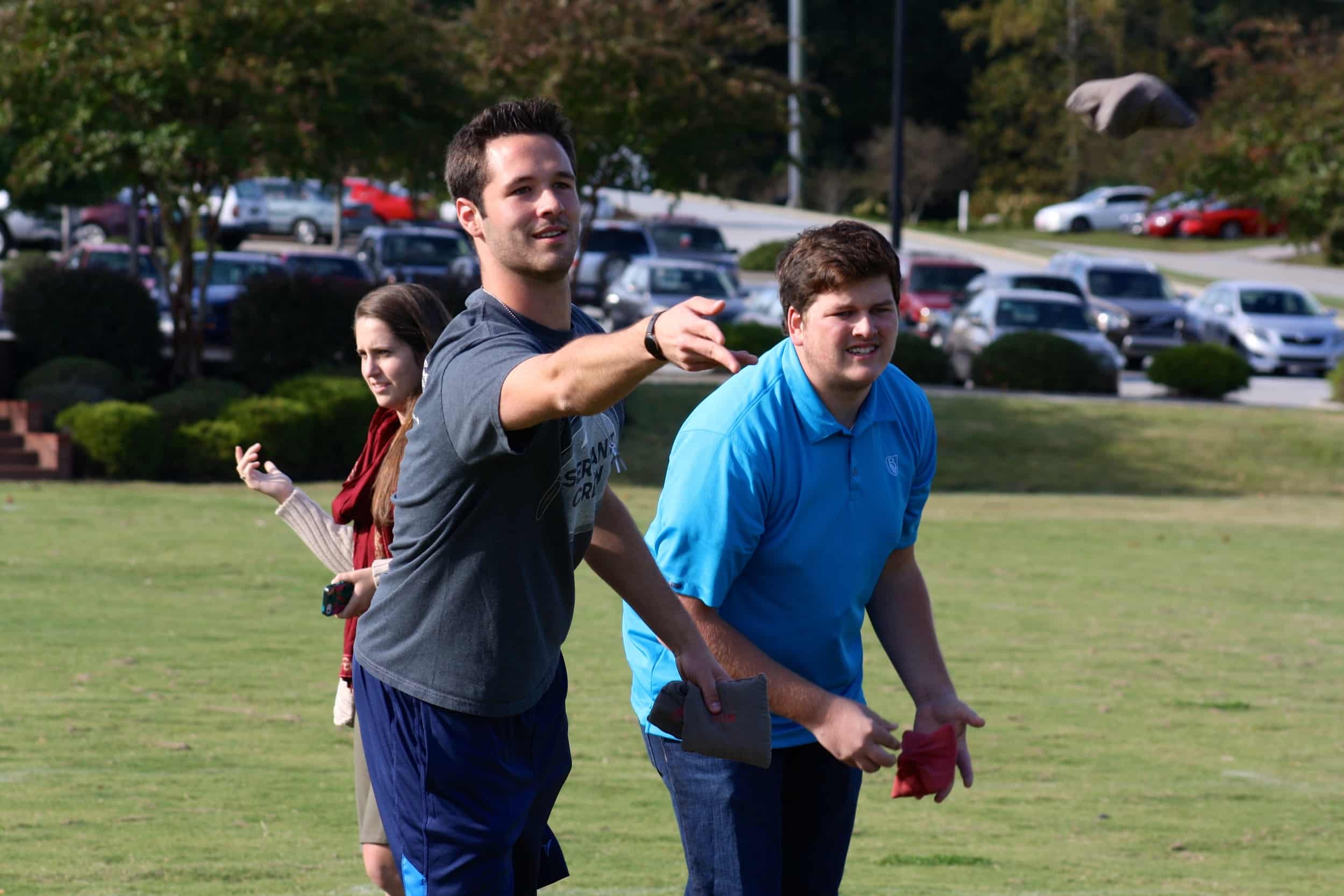  A team of students take their turn in the corn-hole tournament. 