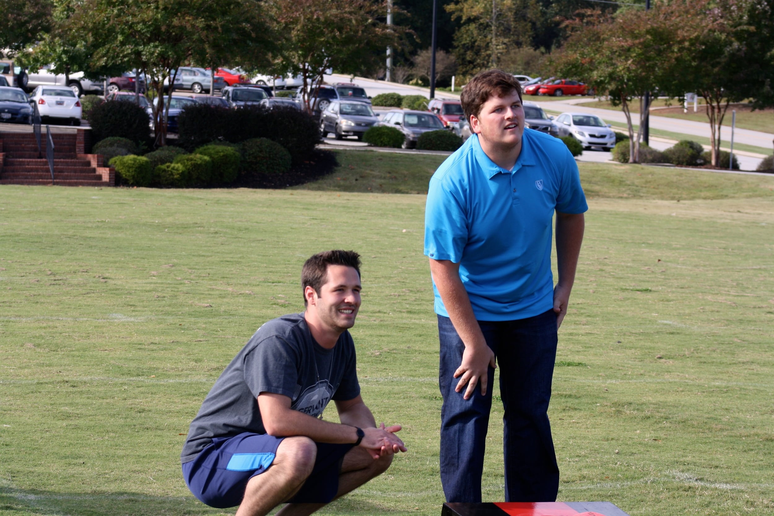  Two students observe their competitors technique. 