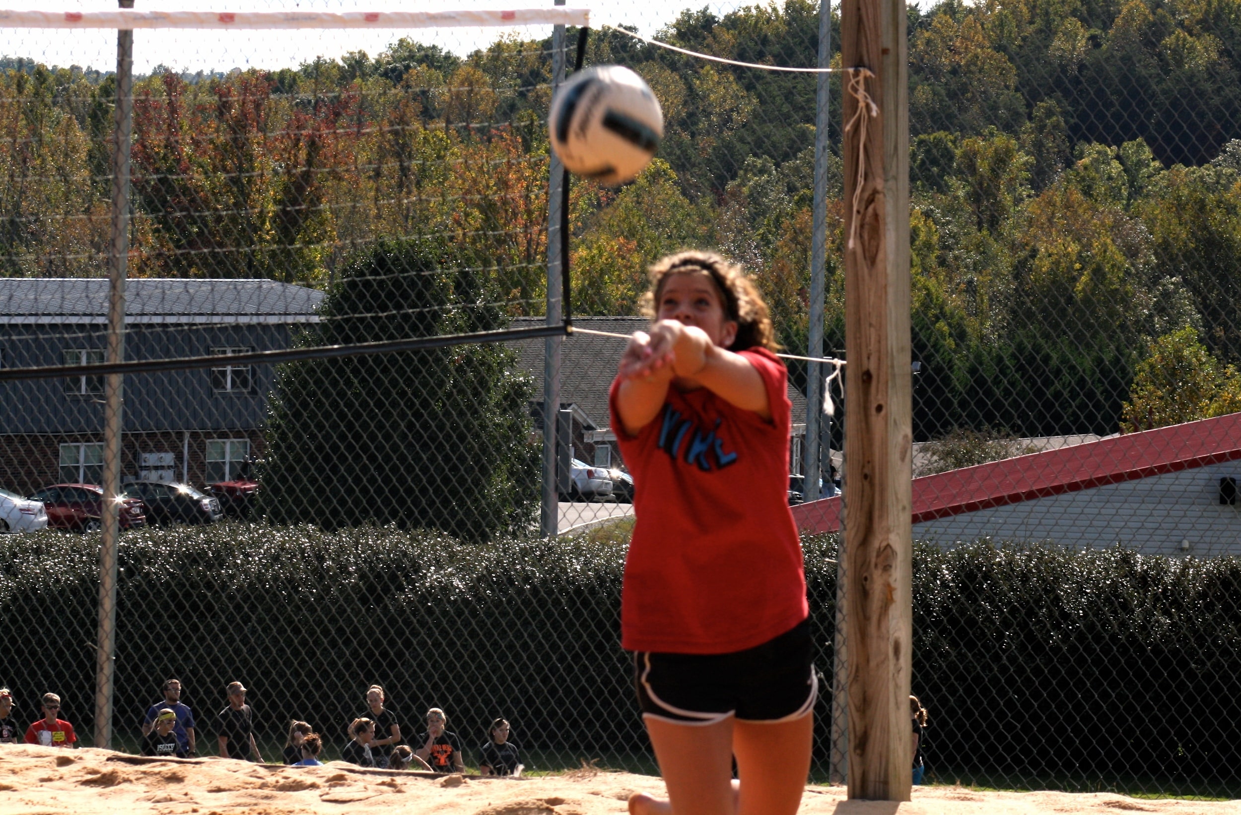  A student bumps the ball to a teammate. 