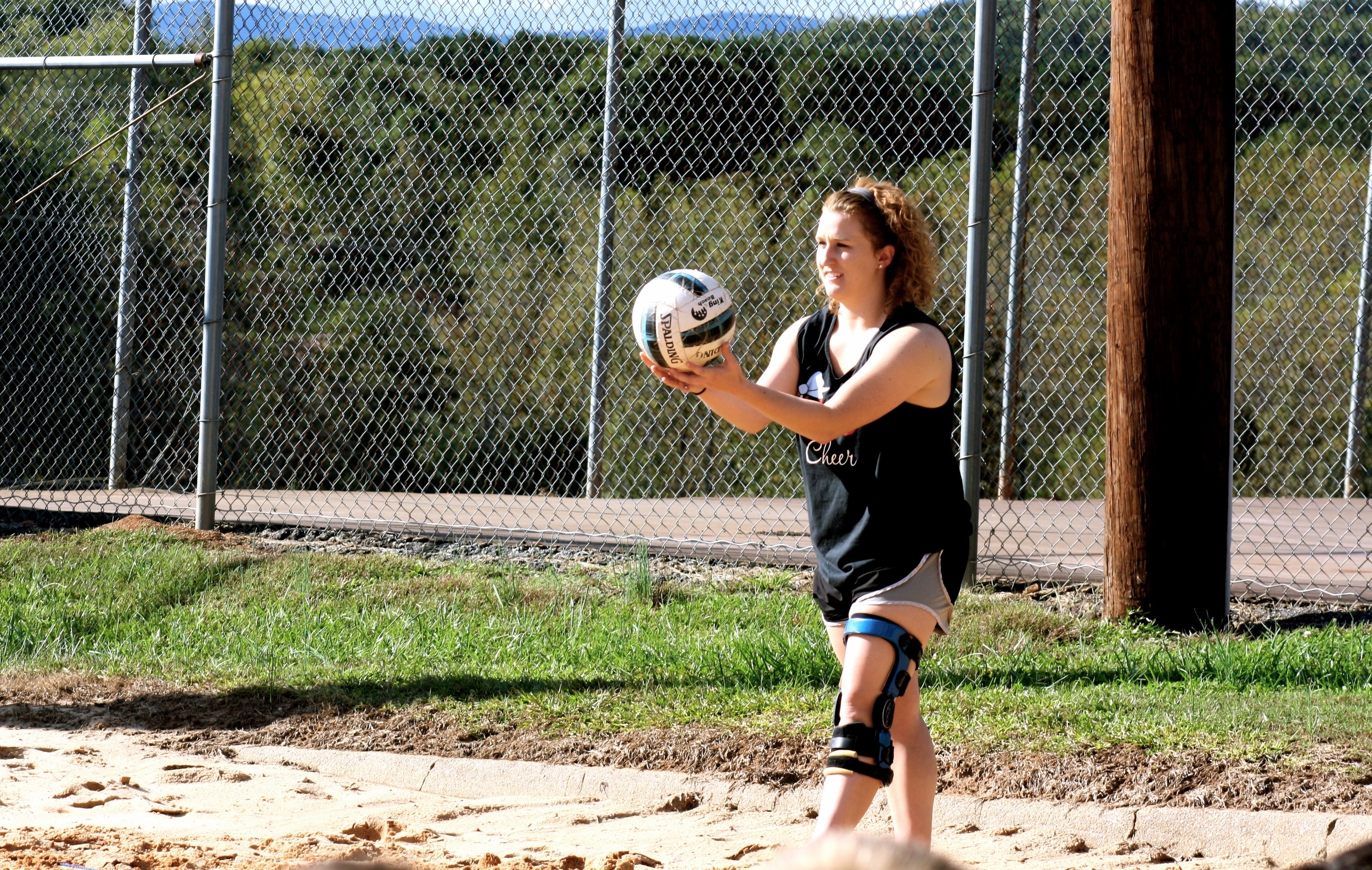  A student prepares to serve the ball. 