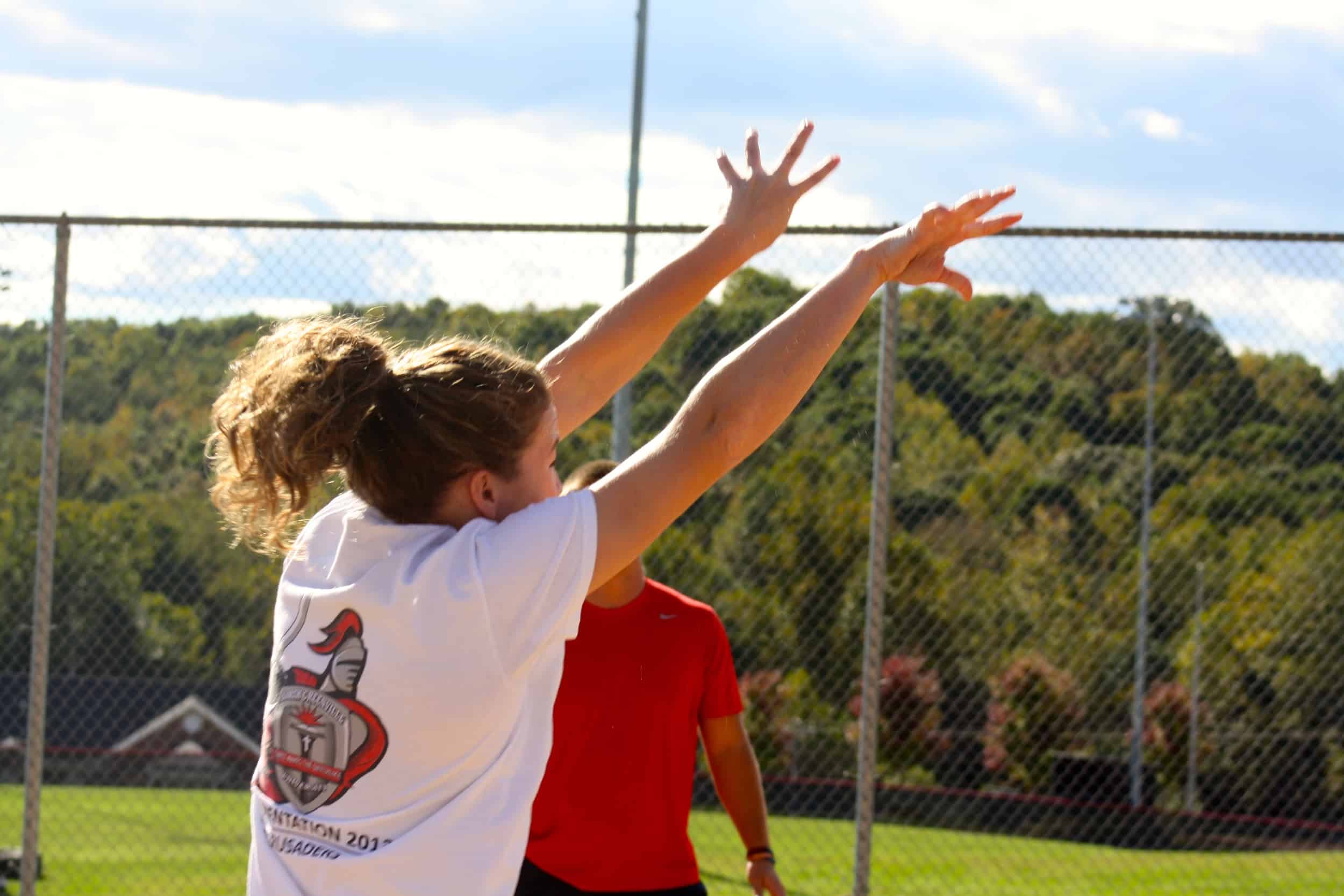  A student sets the ball back over the net. 