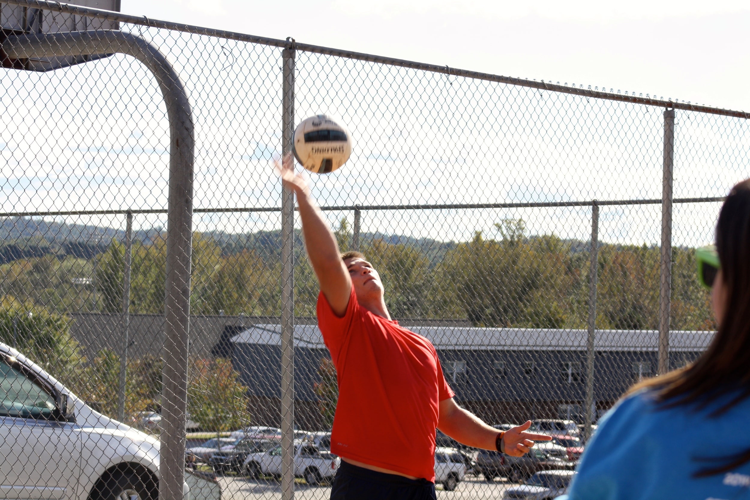  A students smacks the ball. 