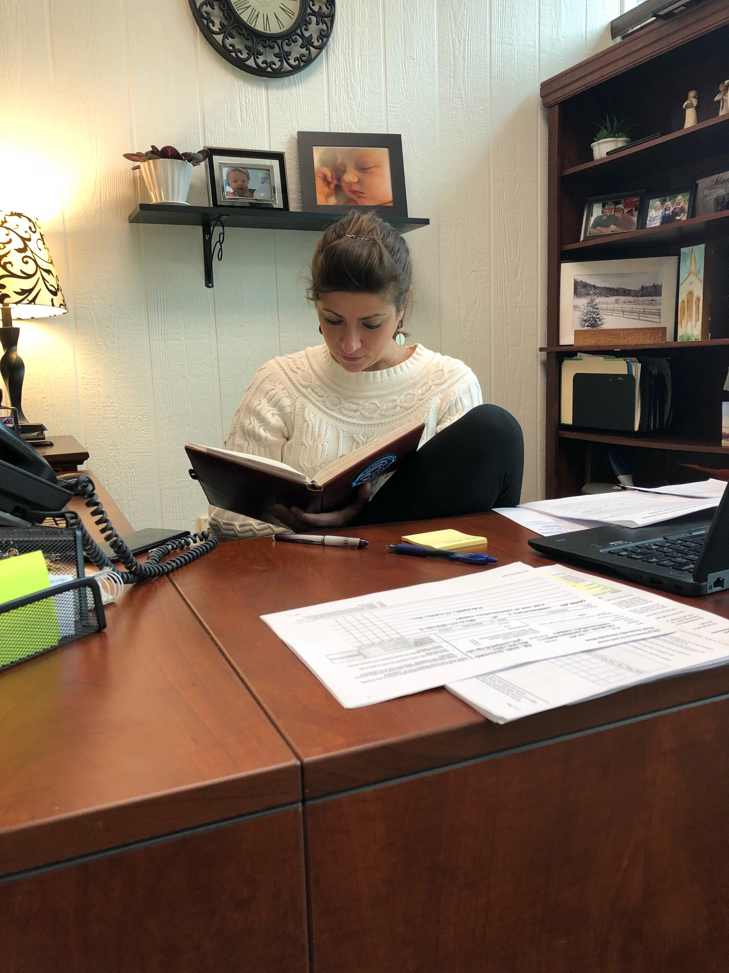 Lydia Rodgers reviews her schedule sitting at her desk.