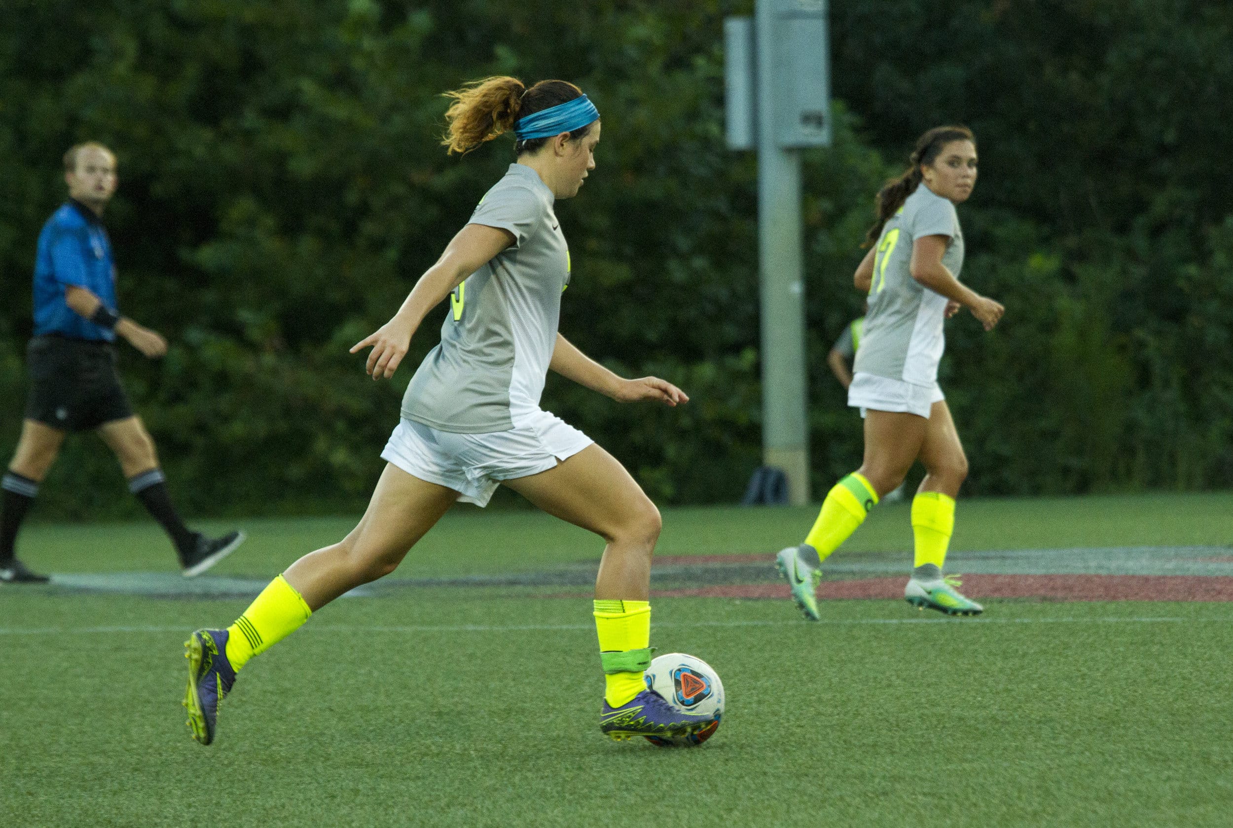  Senior Karis Hoover dribbles the ball past the midfield in attempts to get it in position to make a shot on goal or pass to another teammate.&nbsp; 