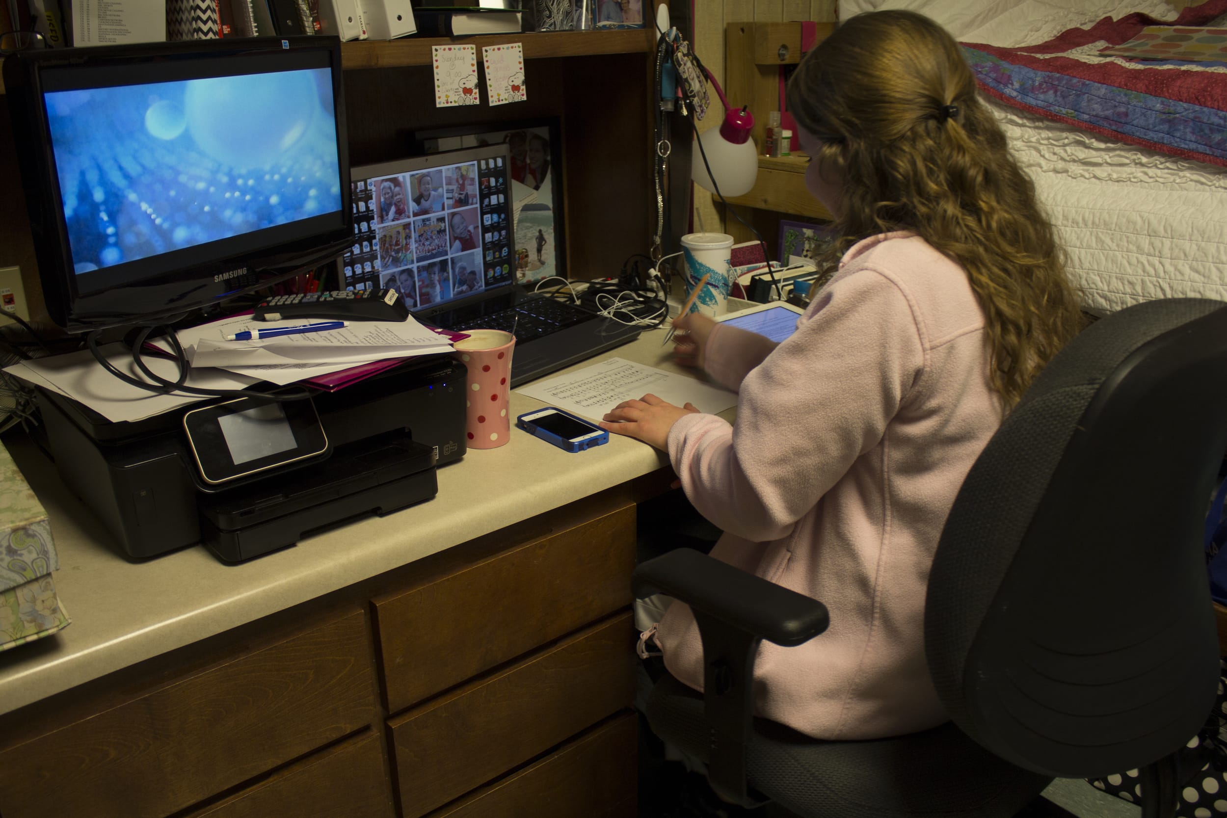  Sophomore Marianne Woodard enjoys the peace and solitude of her dorm room to work on some homework while a few of her friends pop into her room during open dorms. 