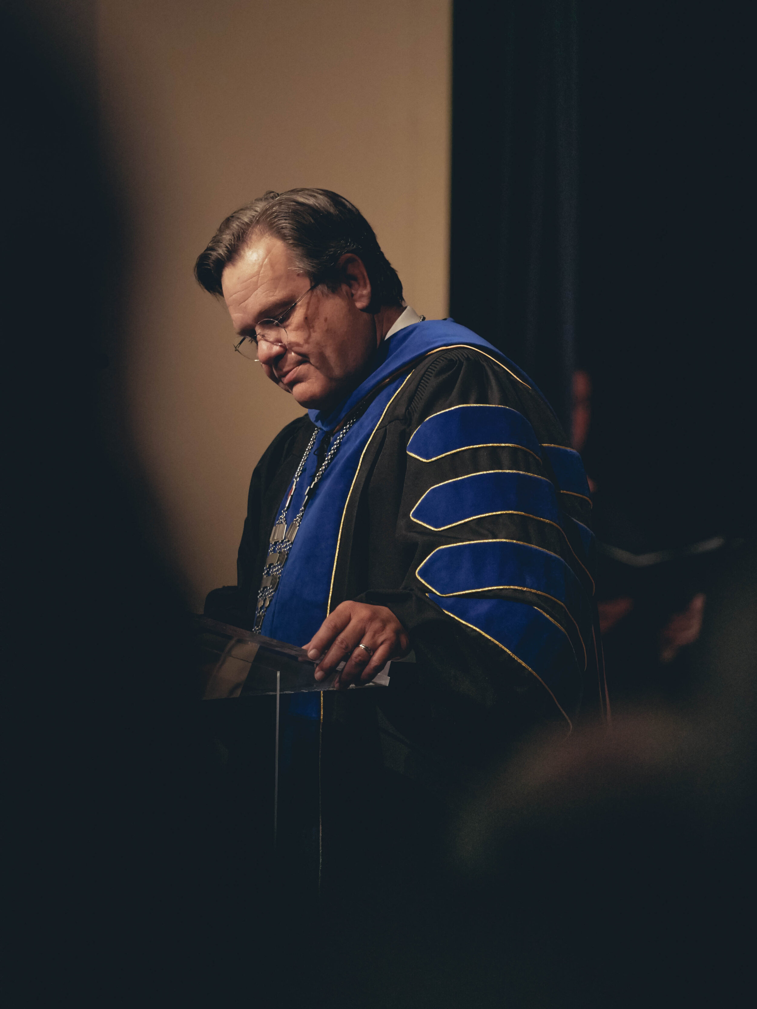 Gene Fant leads the congregation in prayer and introduces the guest speaker.