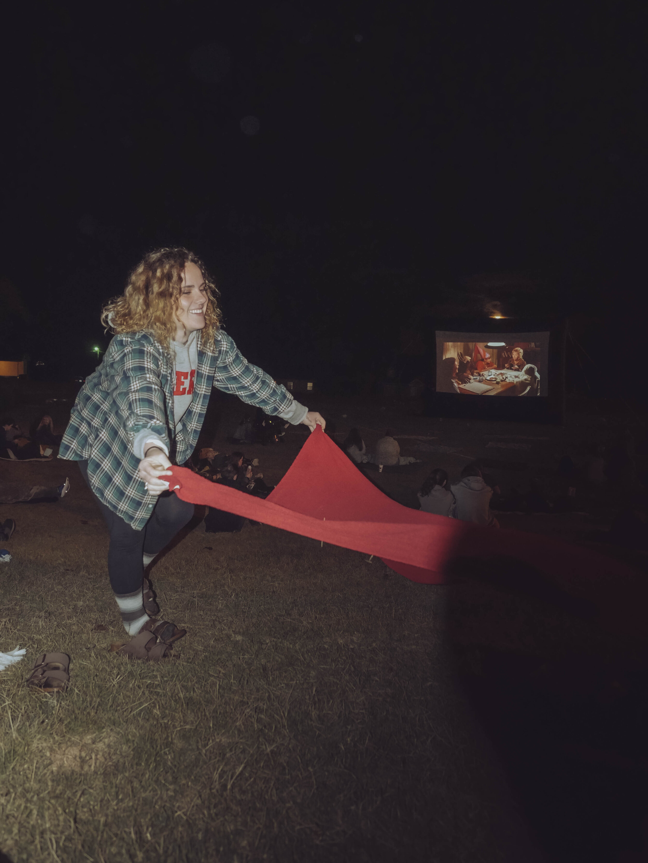 Sophomore Shianne Parsons lays out a blanket on the lawn.