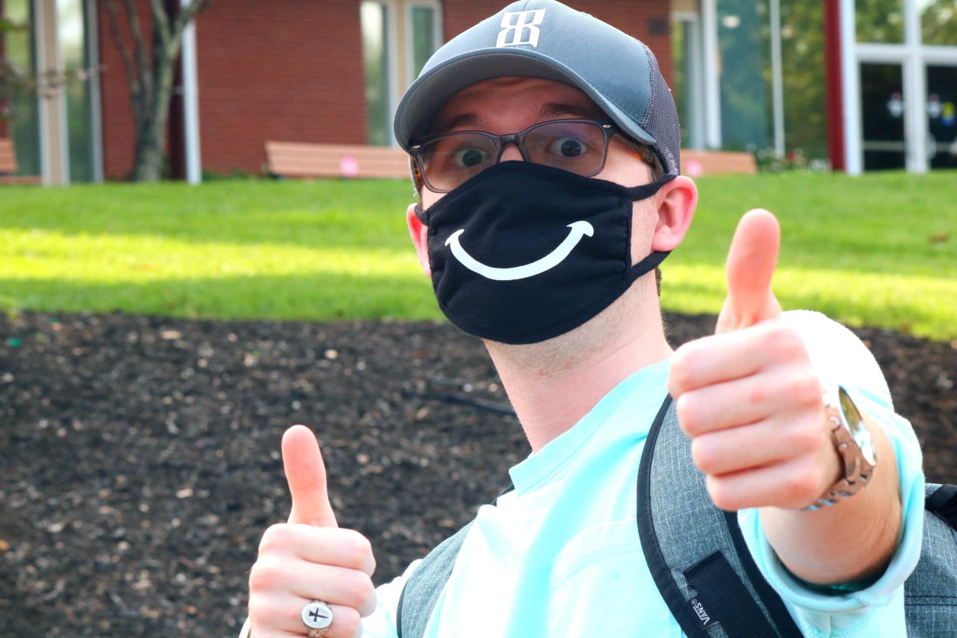 Austin Hughes, junior, is a Broadcast Media major who enthusiastically wears his mask when turned upright.