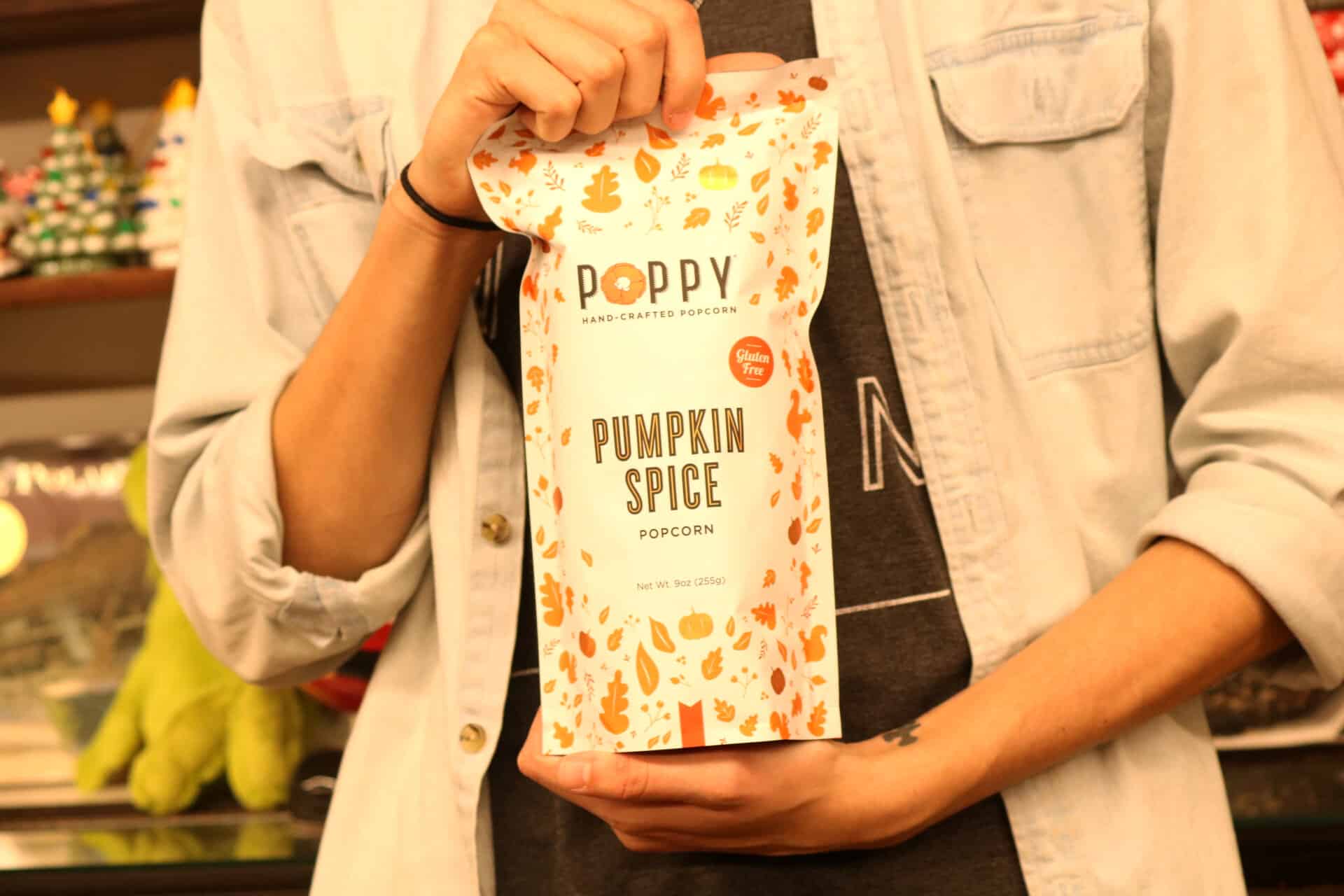 JP Waynick, sophomore worship studies major shows off his pumpkin spice popcorn that can found in the Mast General Store in Hendersonville, N.C.
