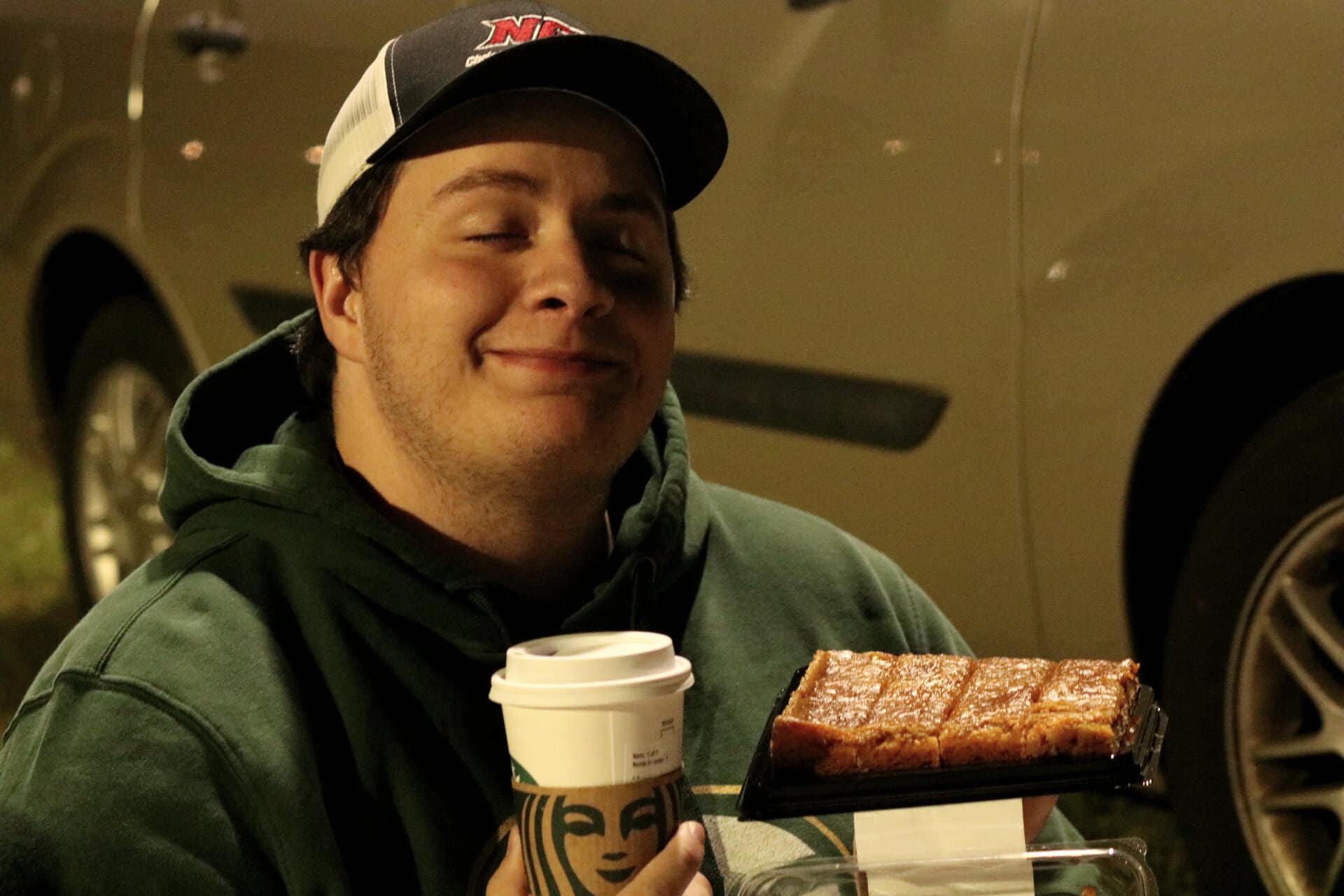 Dru Reilly, sophomore youth ministry major, displays his pumpkin decadent bars from Publix.