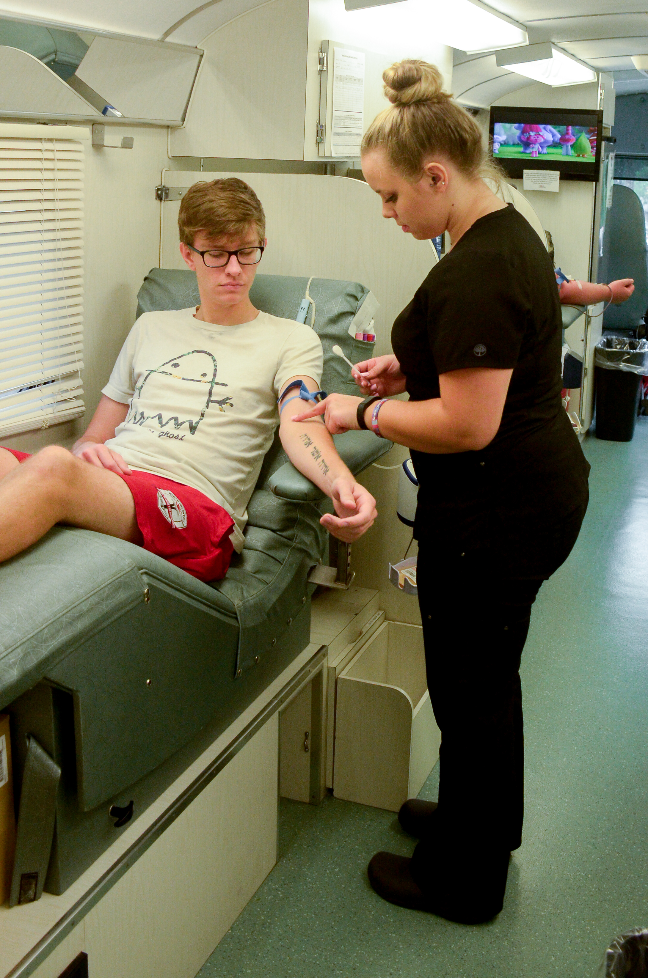 Junior Joshua Childers prepares himself for his first time of giving blood.