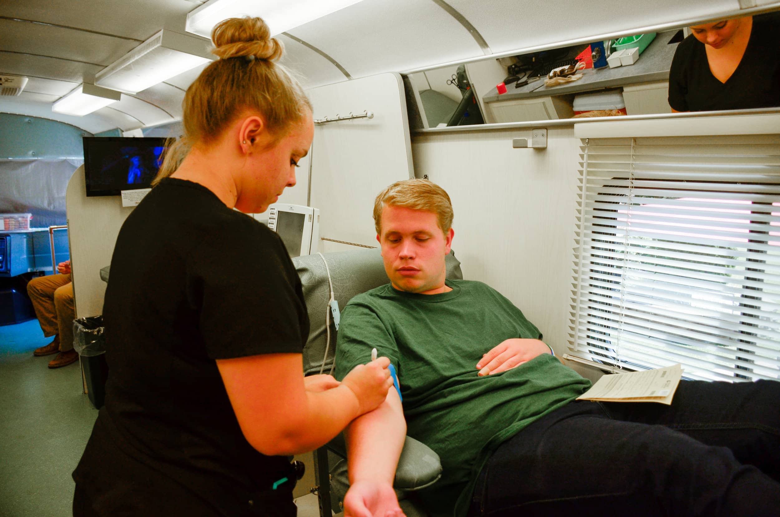 Austin Cathey, sophomore, prepares himself to donate blood because, "it's the right thing to do to help those who need blood."&nbsp;