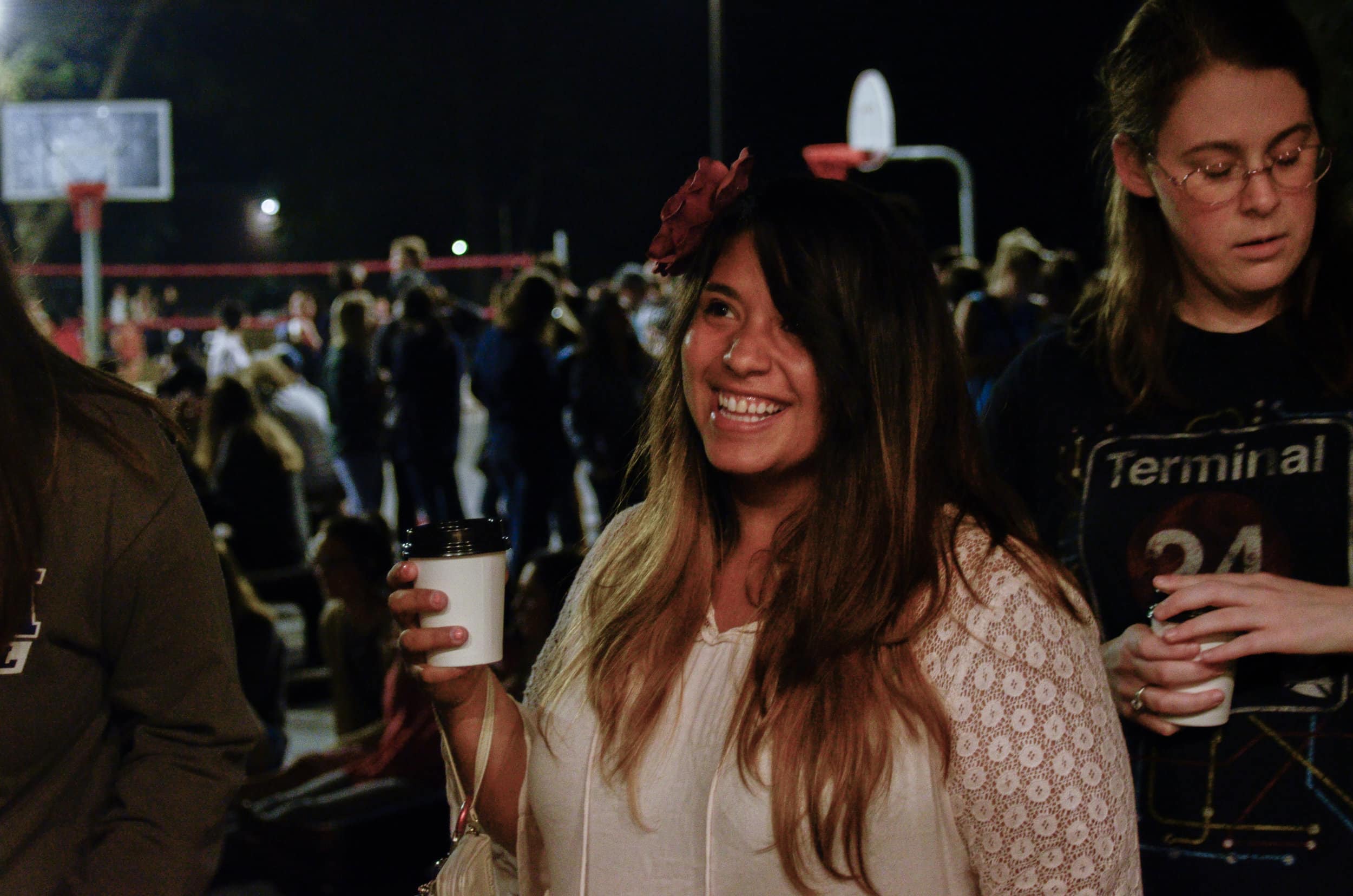 &nbsp;Madi Estela enjoys a night full of entertainment along with small cups of coffee during North Greenville University's Open Mic night on Thursday, September 14.