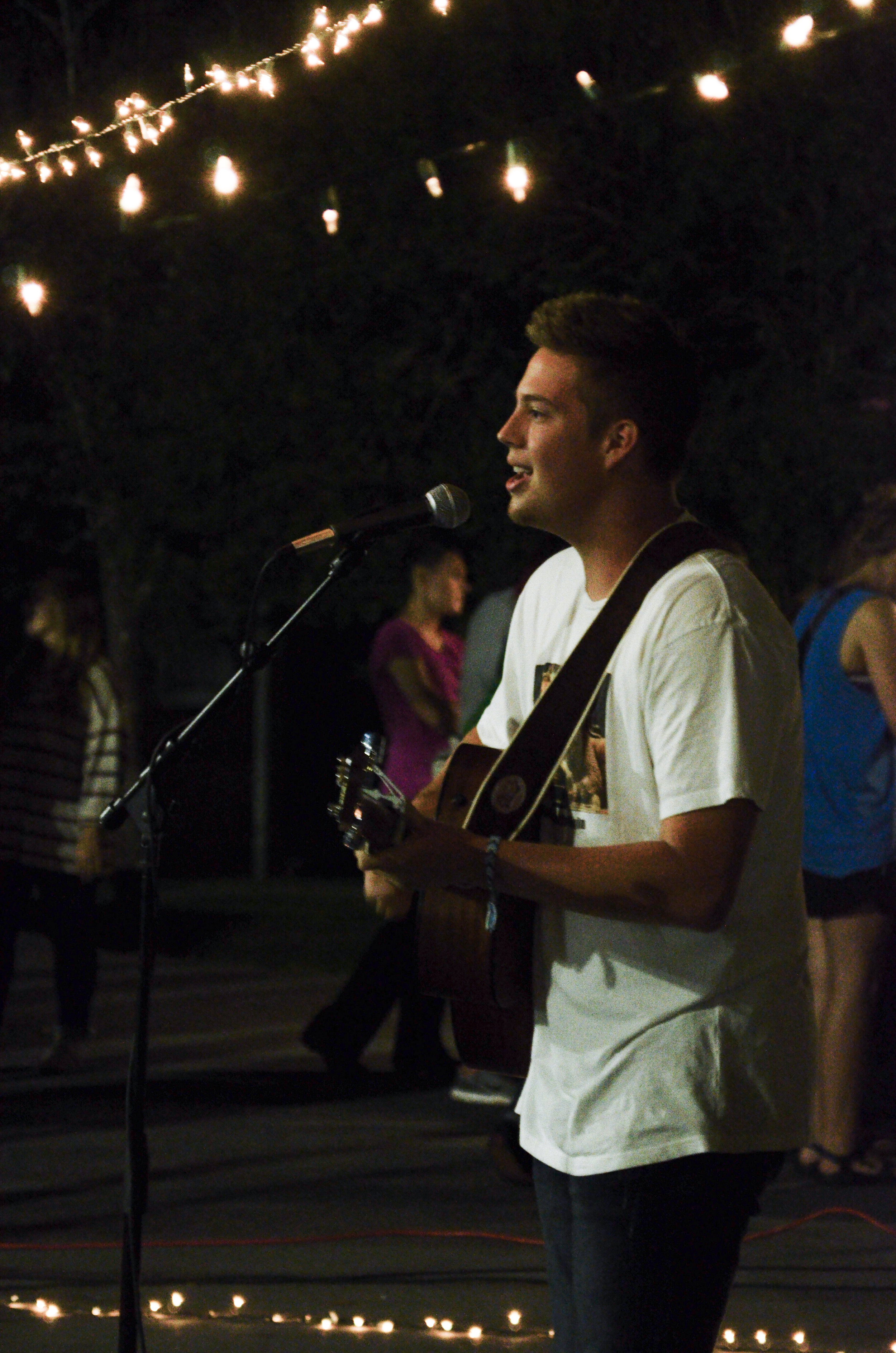 Taylor Brunson plays his guitar and sings "A Drop in the Ocean."