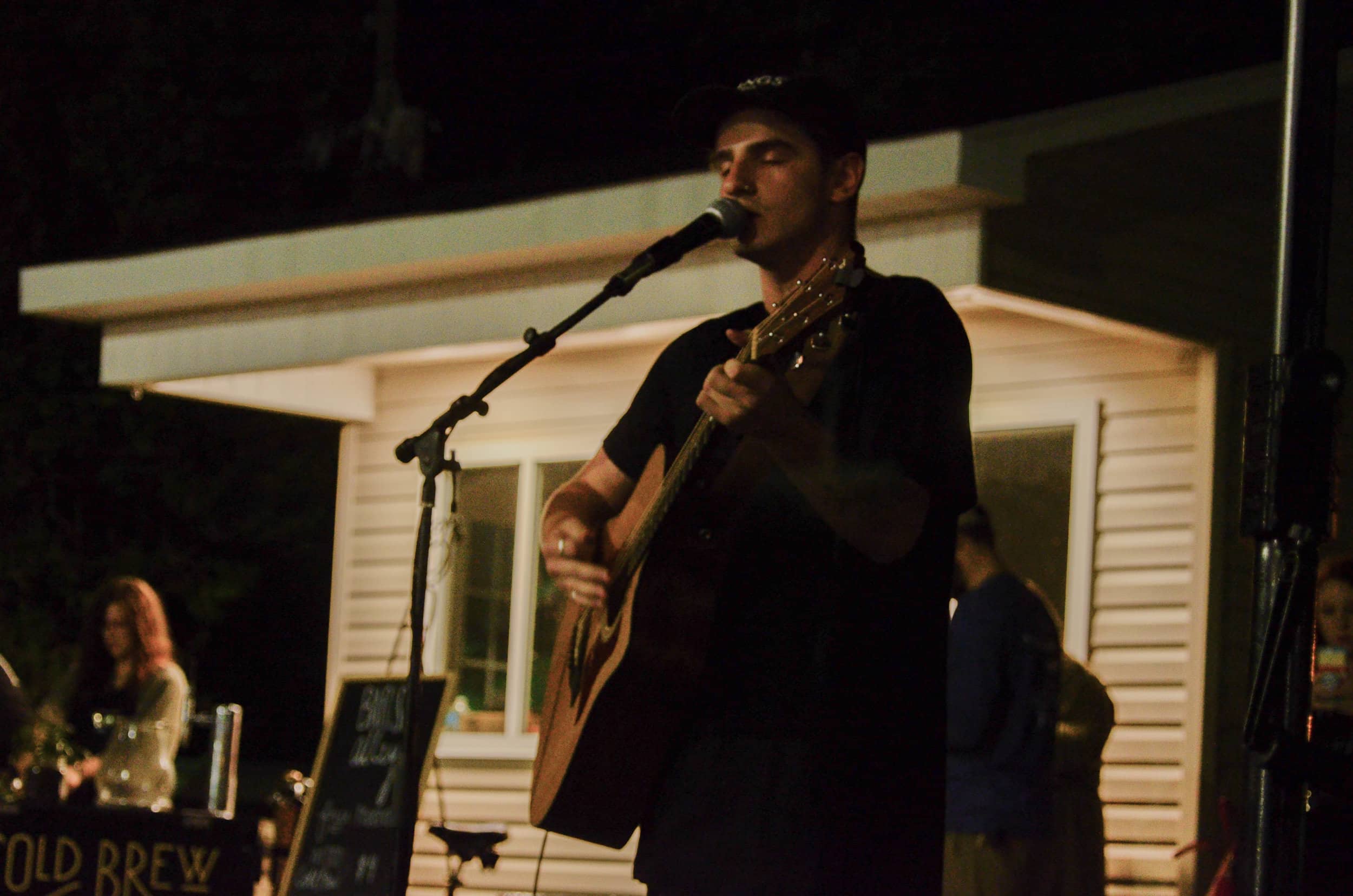 Scott Beardsley plays his guitar and sings "All Time Low."