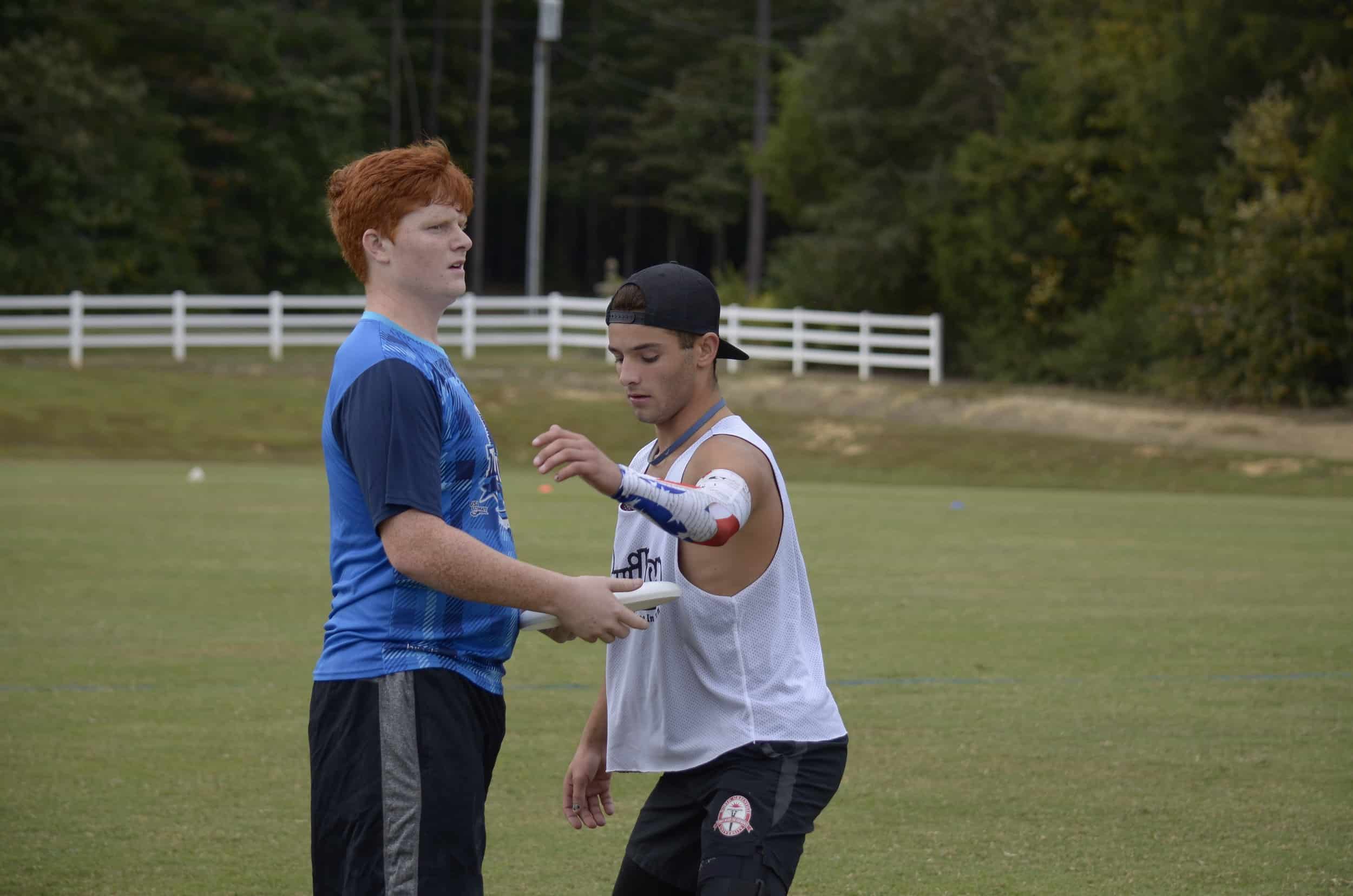 Freshman, Jordan Lewis, pays close attention to the disc in order to get a defensive block and turn the disc over.&nbsp;