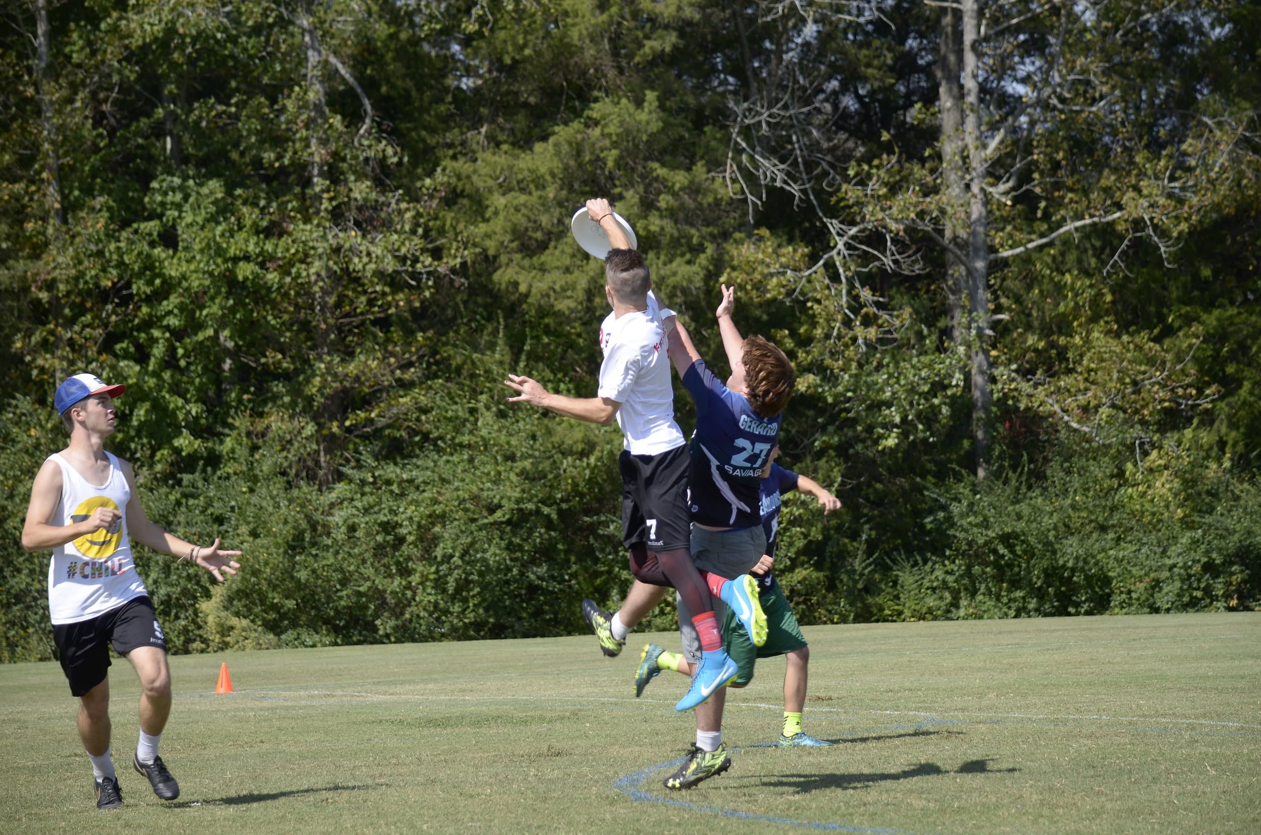 Grayson Holliday catches the disc in the air against William and Mary.