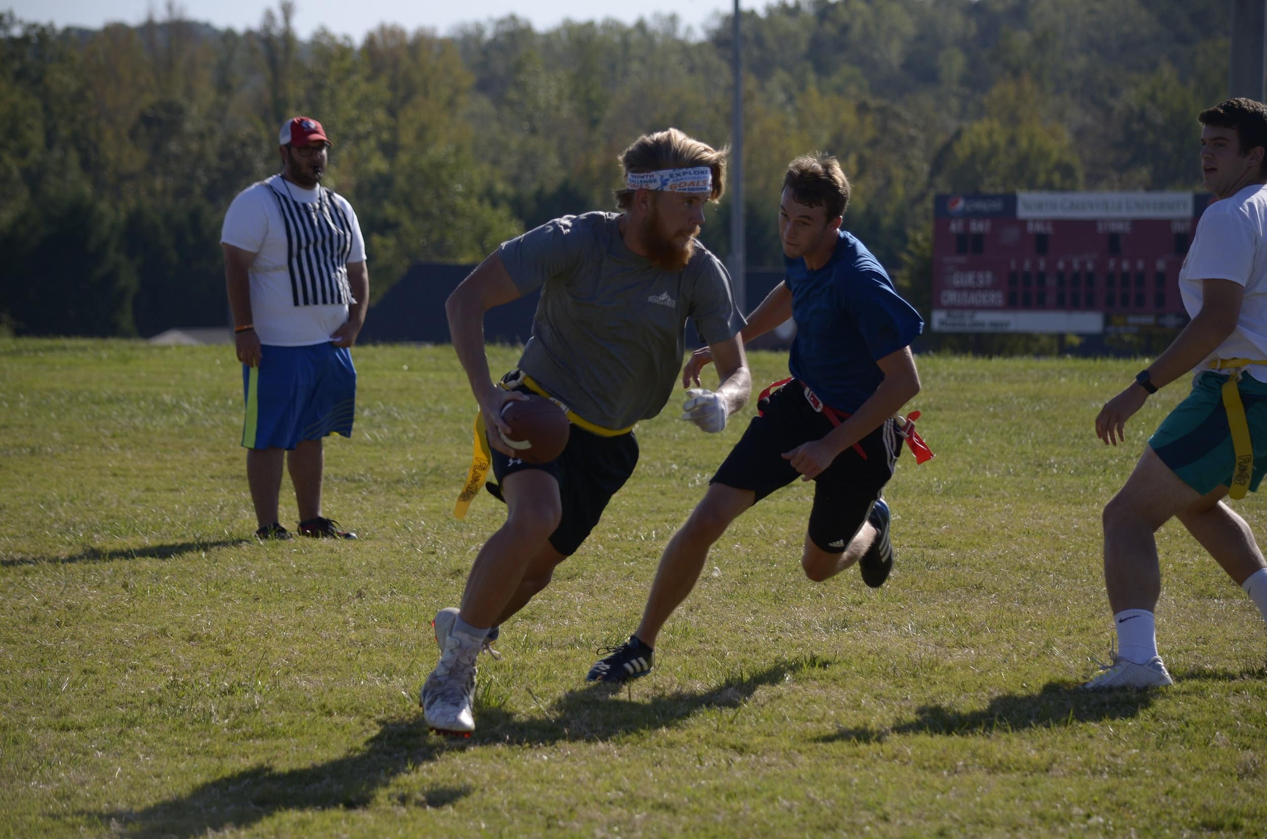 Elias Enniss gets past his defenders to run the ball downfield.