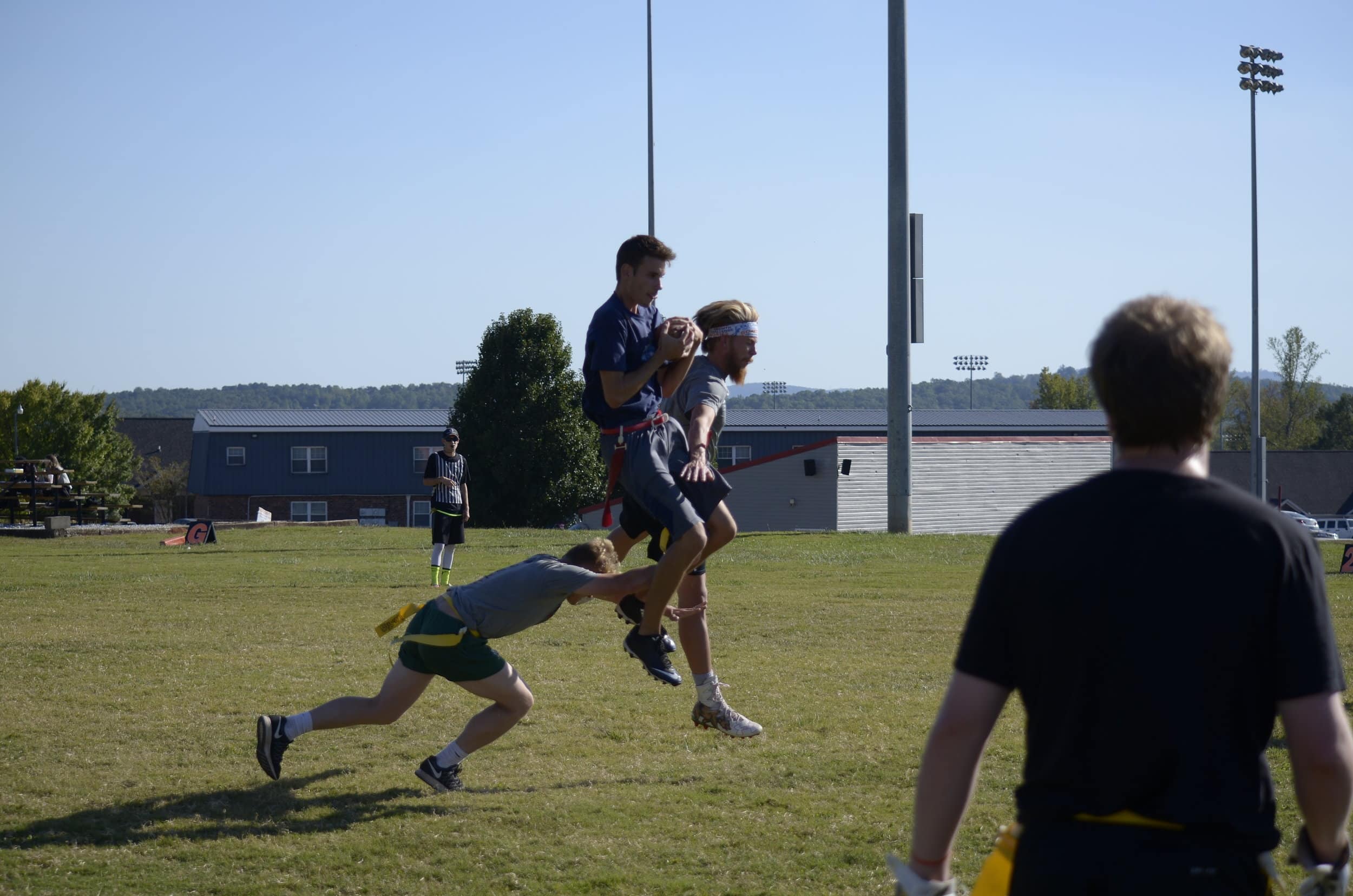 Andrew Chisholm gets up to catch a pass from his teammates around his strong defenders.