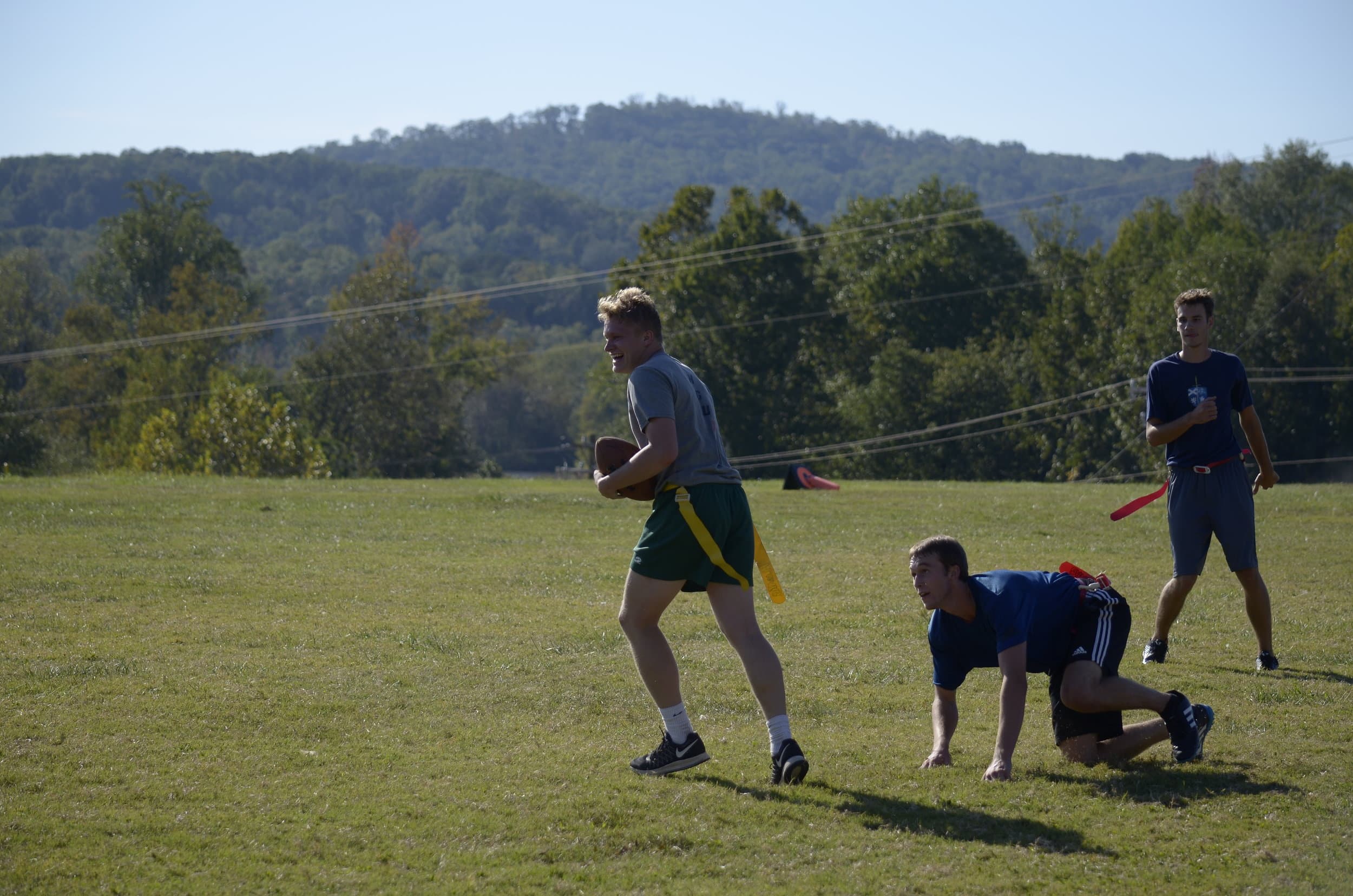Andrew Hail gets through his defenders to carry the ball downfield.&nbsp;