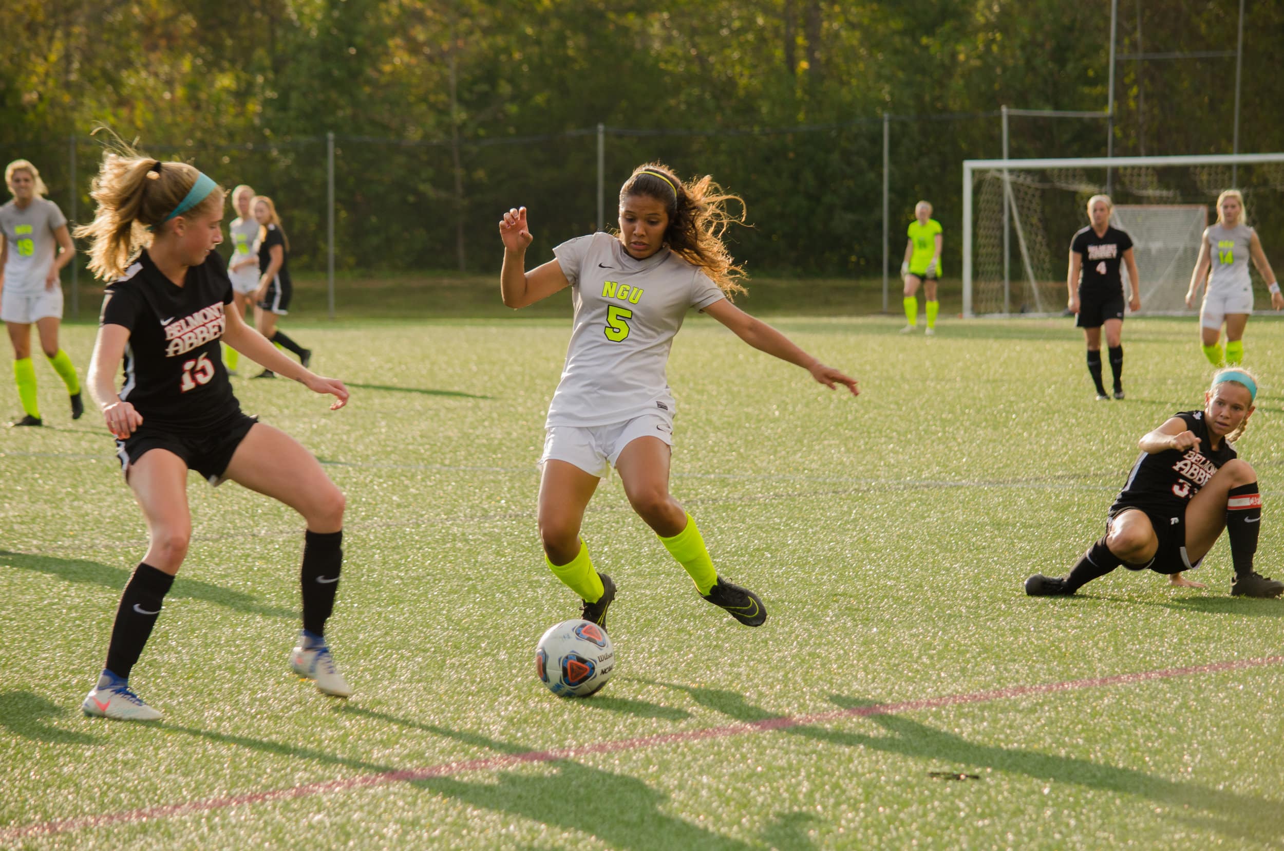 Freshman Heily Hernandez gets past one defender leaving her on her knees and works hard to get past another defender.&nbsp;