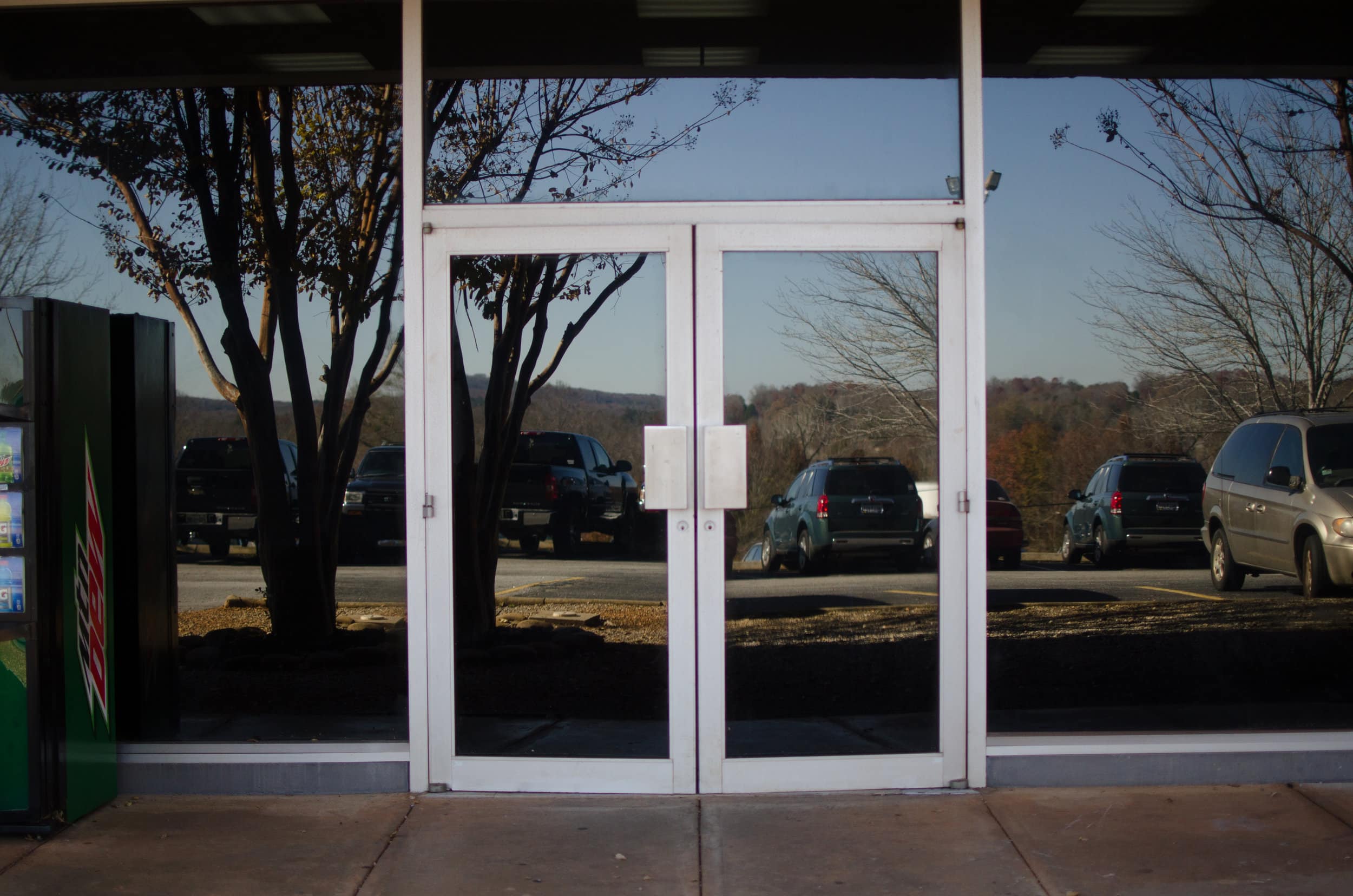 The Brisse Suite contains the language lab and a few classrooms. The entrance to this is outside behind the library. Follow the pathway through the parking lot and behind the library you will see two double doors.
