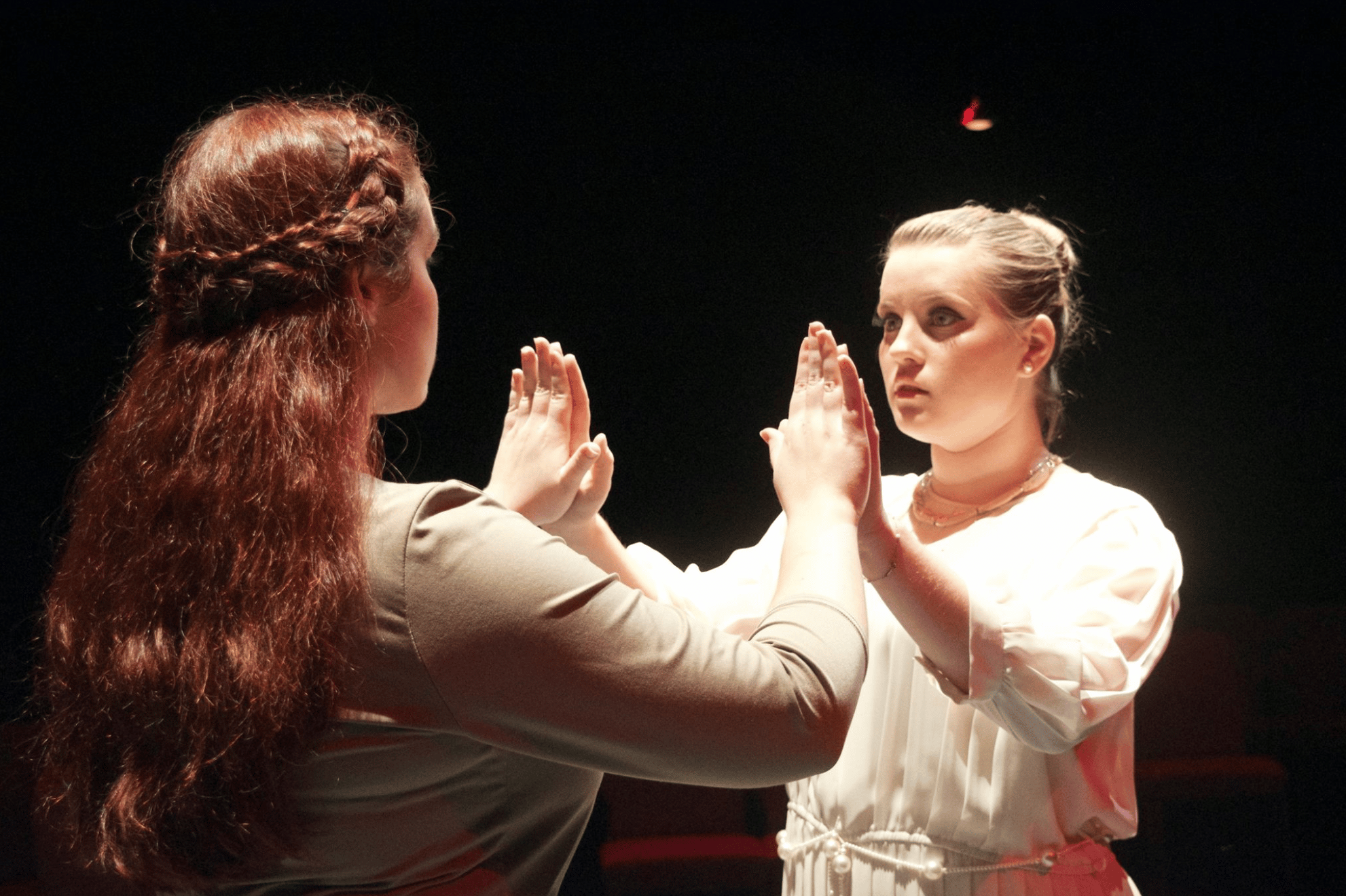 Junior, Ashlynn Butrovich and sophomore, Marlee Daniel intensely perform as Antigone and Ismene.Picture courtesy of NGU Theatre Facebook page