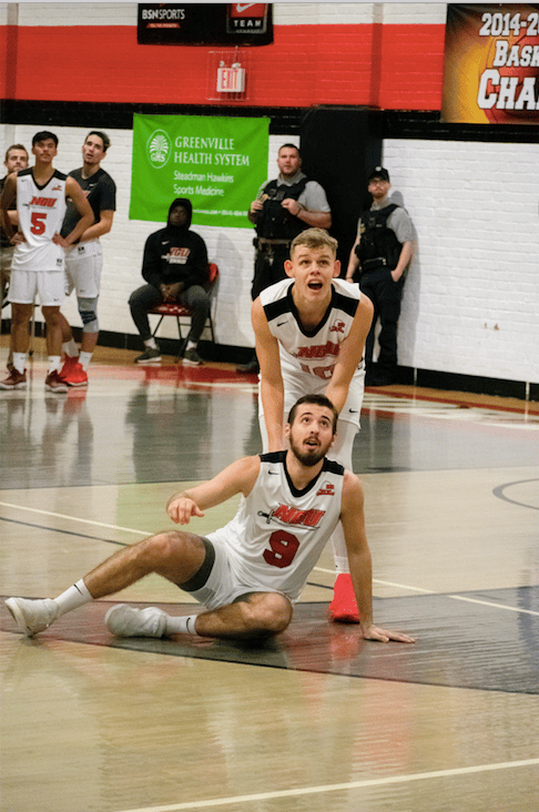 Sophomore Brandon Baker (10) and Senior Grayson Lawrence (9) watch the ball go up and into the student section.