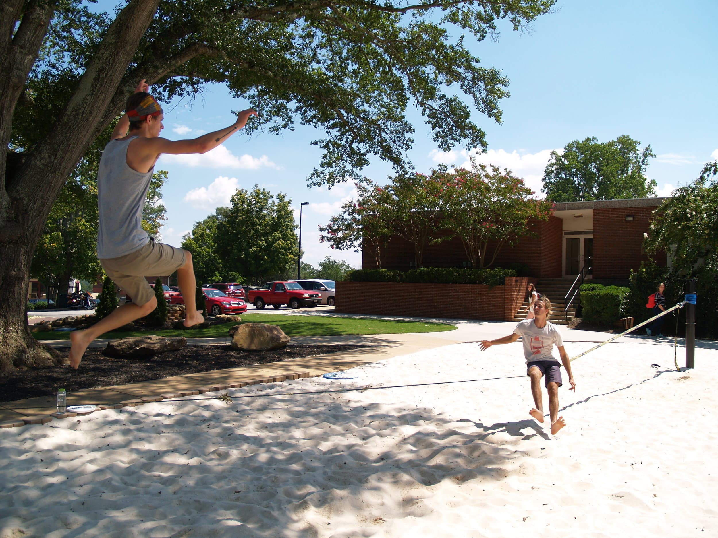   Conner Mcabee and Mac Daniel pull off a slack lining stunt in front of students.&nbsp;  