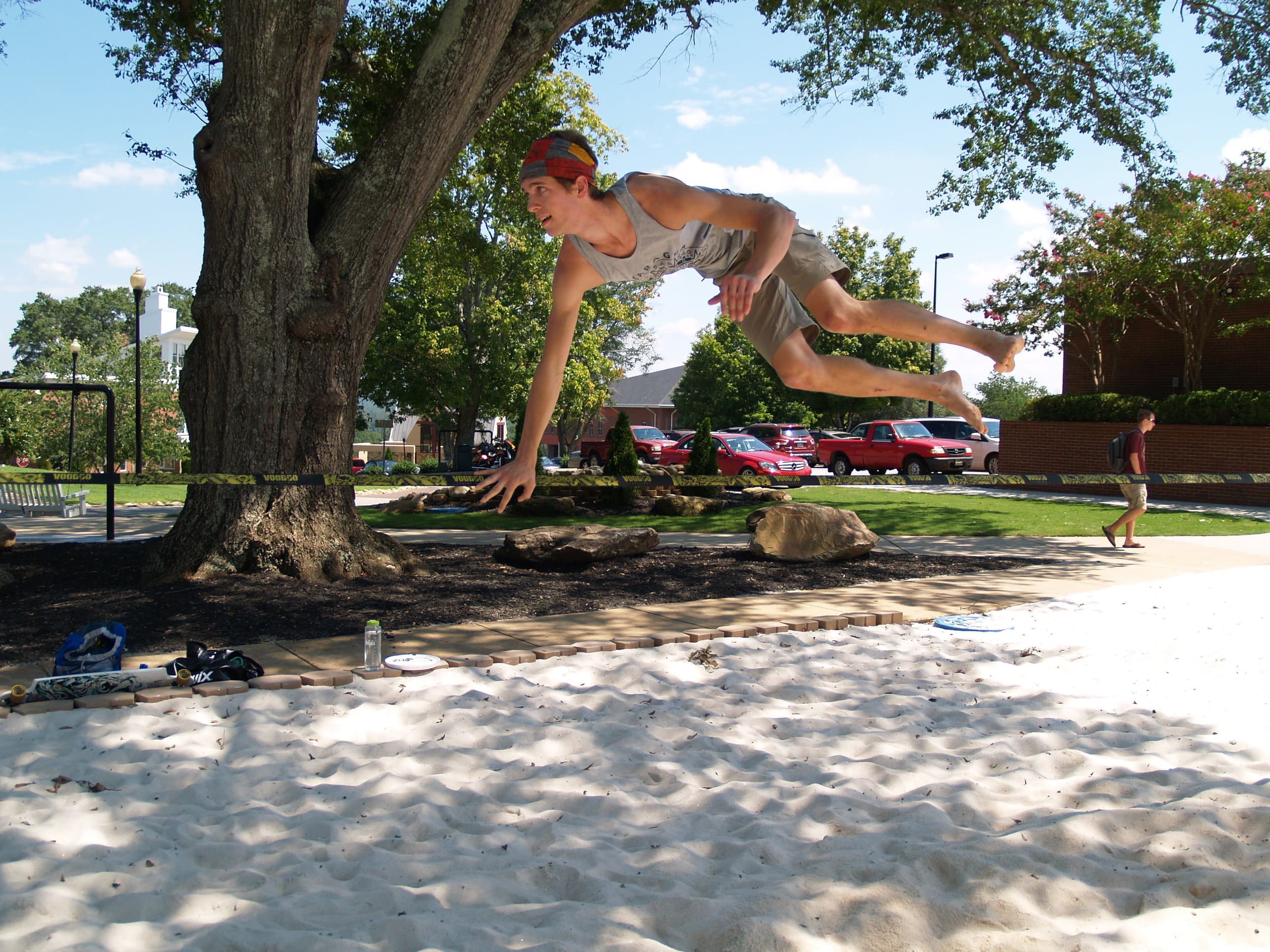   NGU senior Conner Mcabee tries out a few different slack lining tricks.&nbsp;  