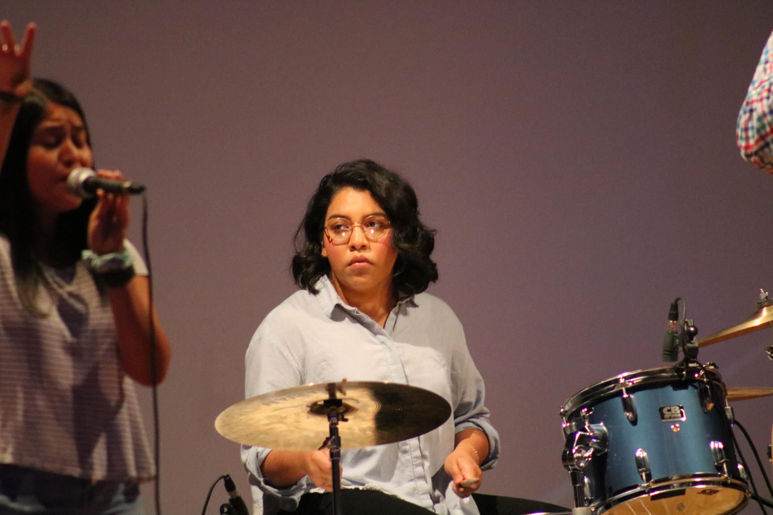Sophomore Vanessa Martinez (drums) watches for a cue from fellow band mates while theyre playing.