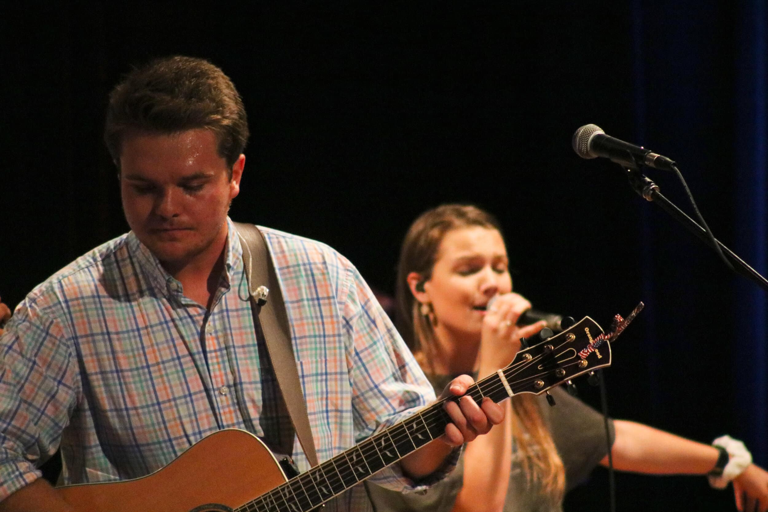 Shirk focuses on his guitar and worshipping while sophomore Carrie Rust (vocals) sings with the others.