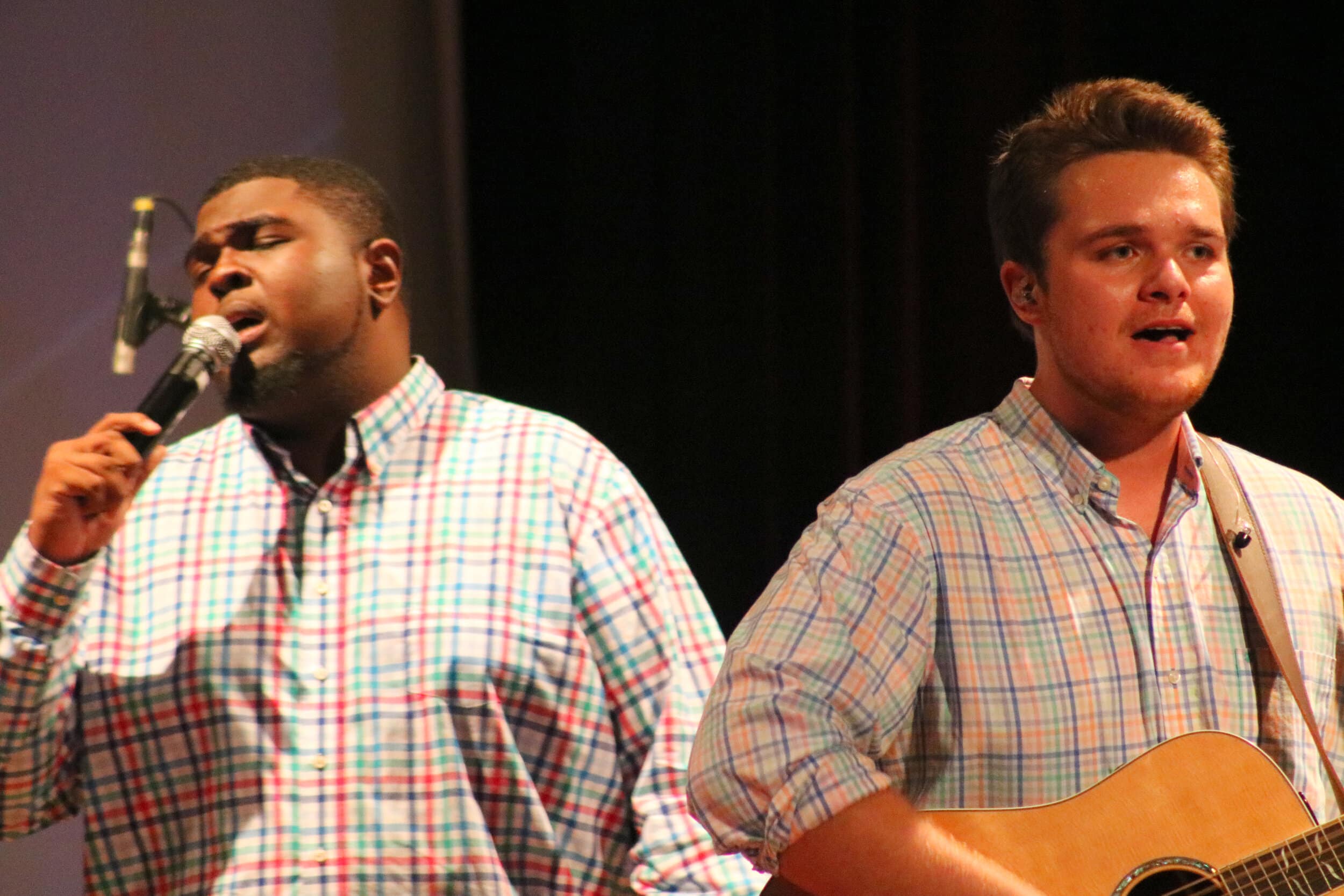 Scotland and Shirk lead worship during the last song, which was Tremble by Mosaic MSC.
