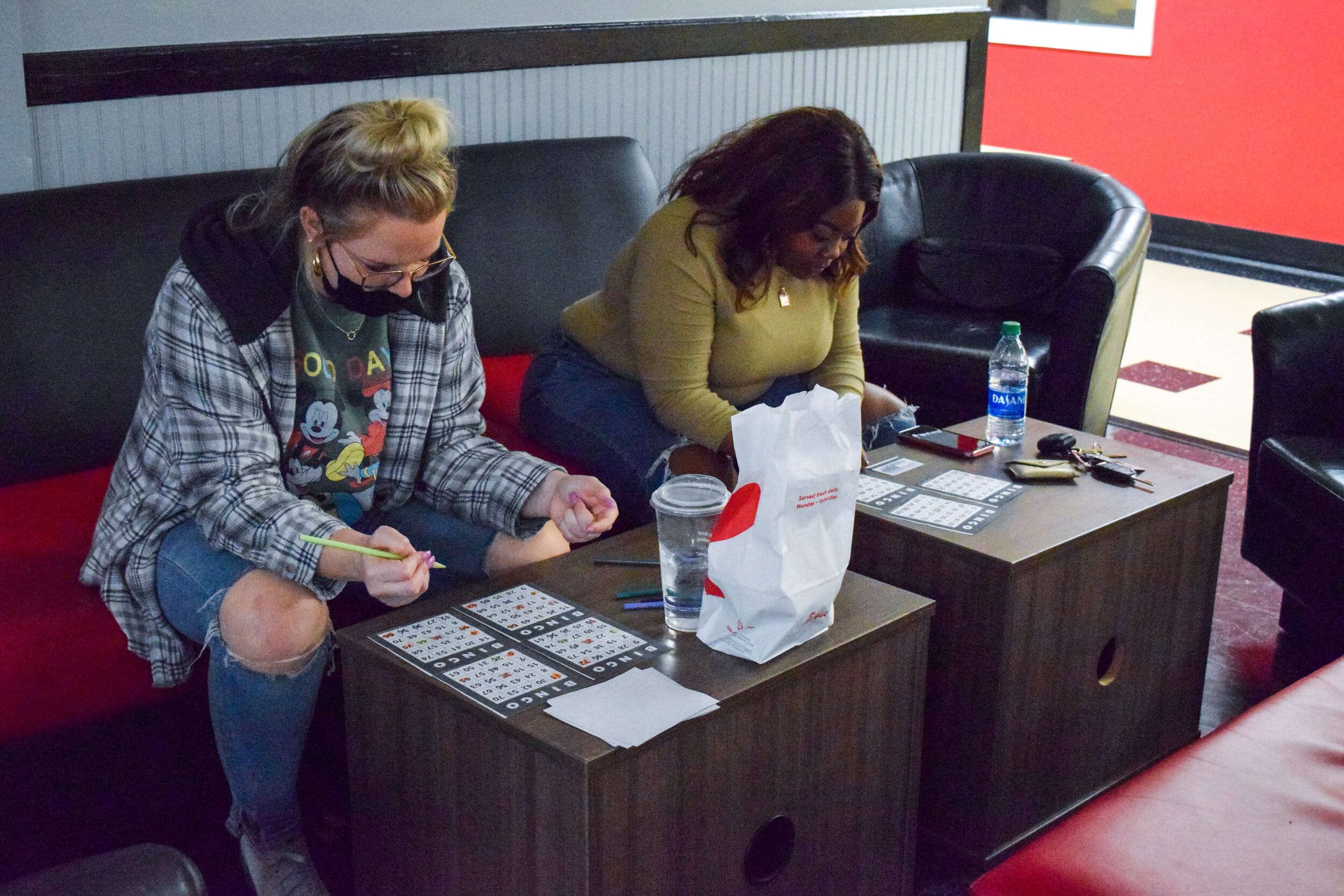 Logan Jolley, junior early childhood education major and Alax Middleton, sophomore business major concentrate intently on the bingo cards.