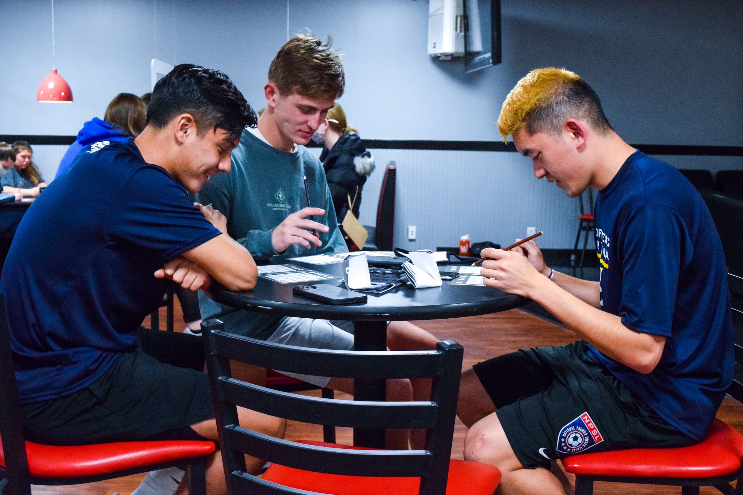 Arthur Santana, freshman business major, Isaiah Mayhap, junior accounting major and Soto Kubo, senior biology major listen for the next combination.