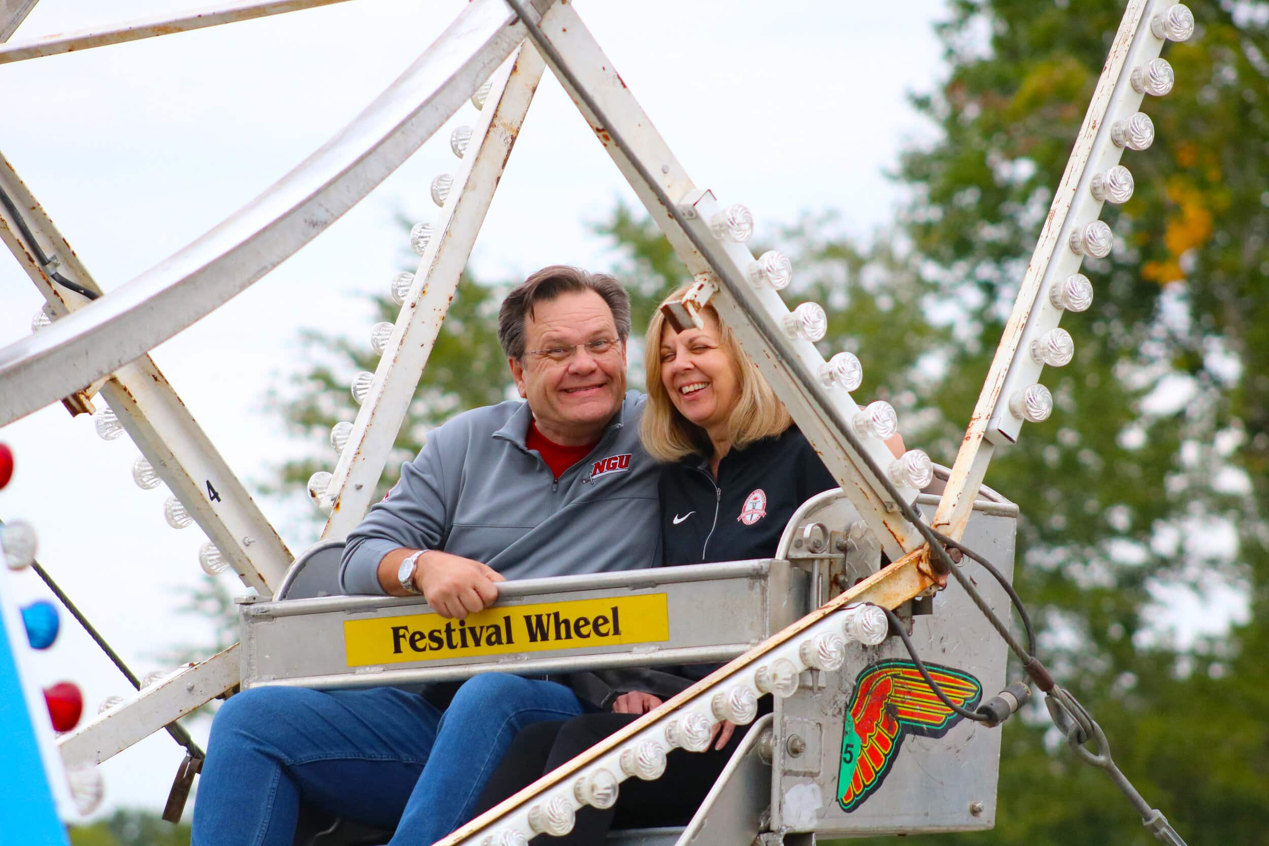 Dr. and Mrs. Fant are part of the first group of people to enjoy the Ferris wheel.