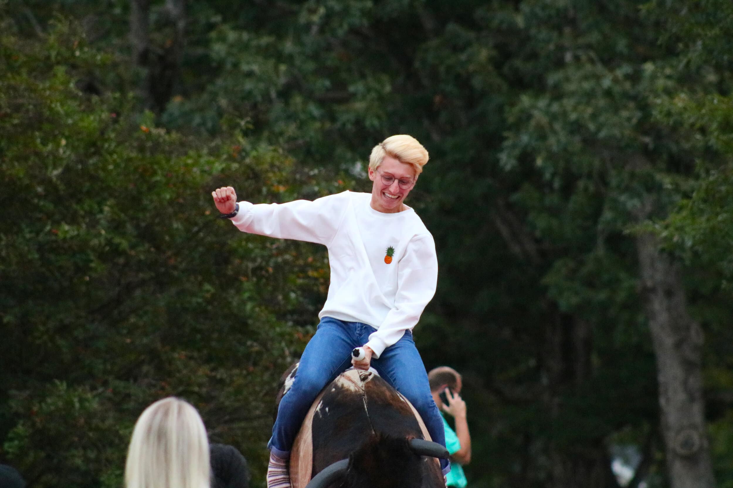 Sophomore Jacob Holcombe tries not to fall off of the mechanical bull.
